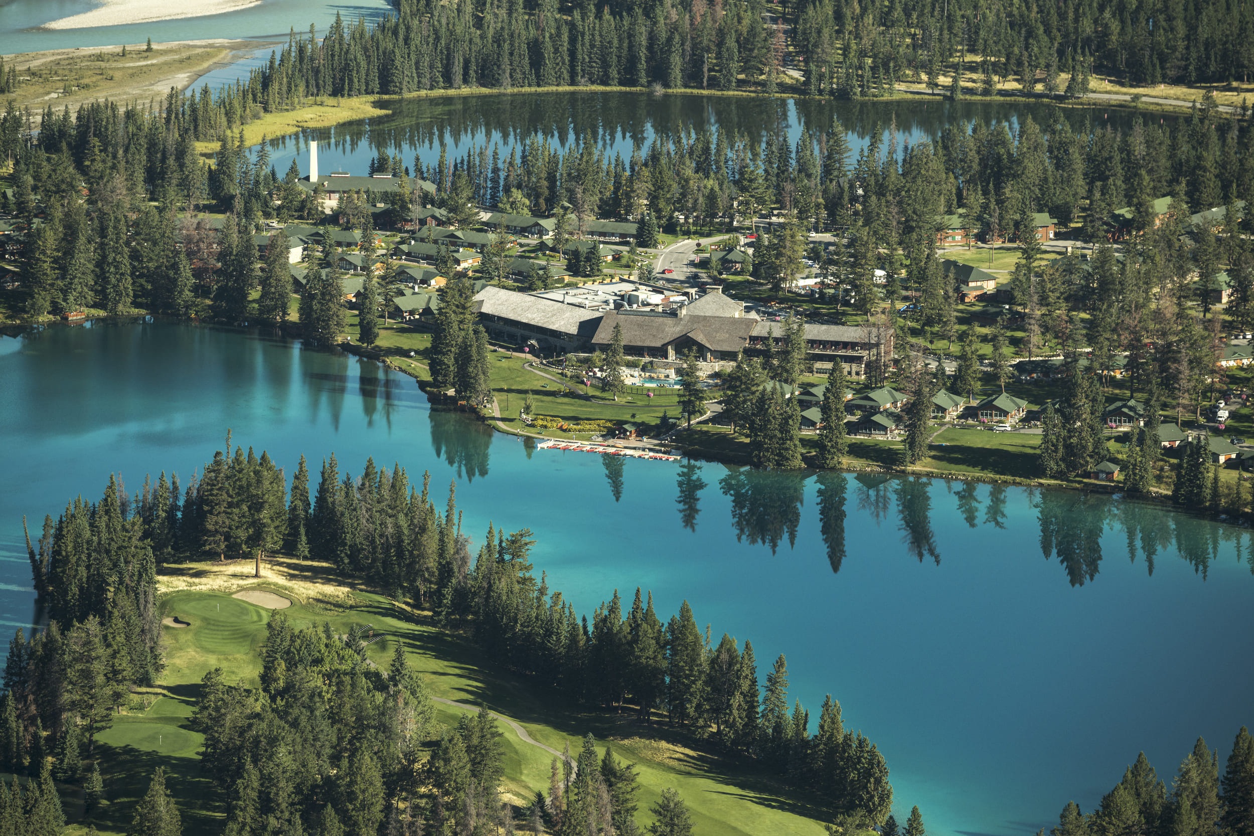 Aerial view of lodge buildings beside the lake at Fairmont Jasper Park Lodge, Jasper, Canada