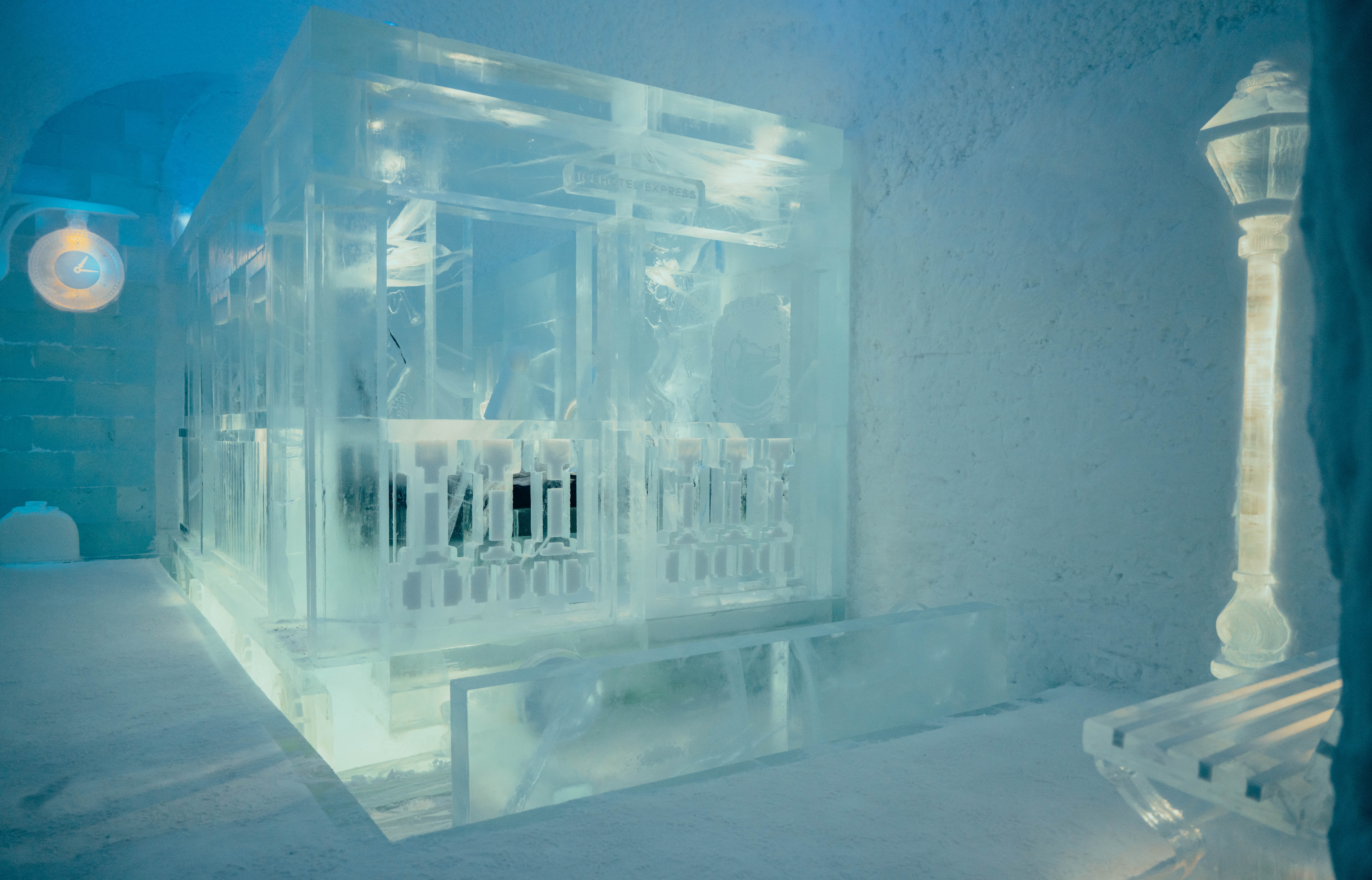 Ice suite with an intricately carved ice interior and bed at Icehotel, Jukkasjärvi, Swedish Lapland