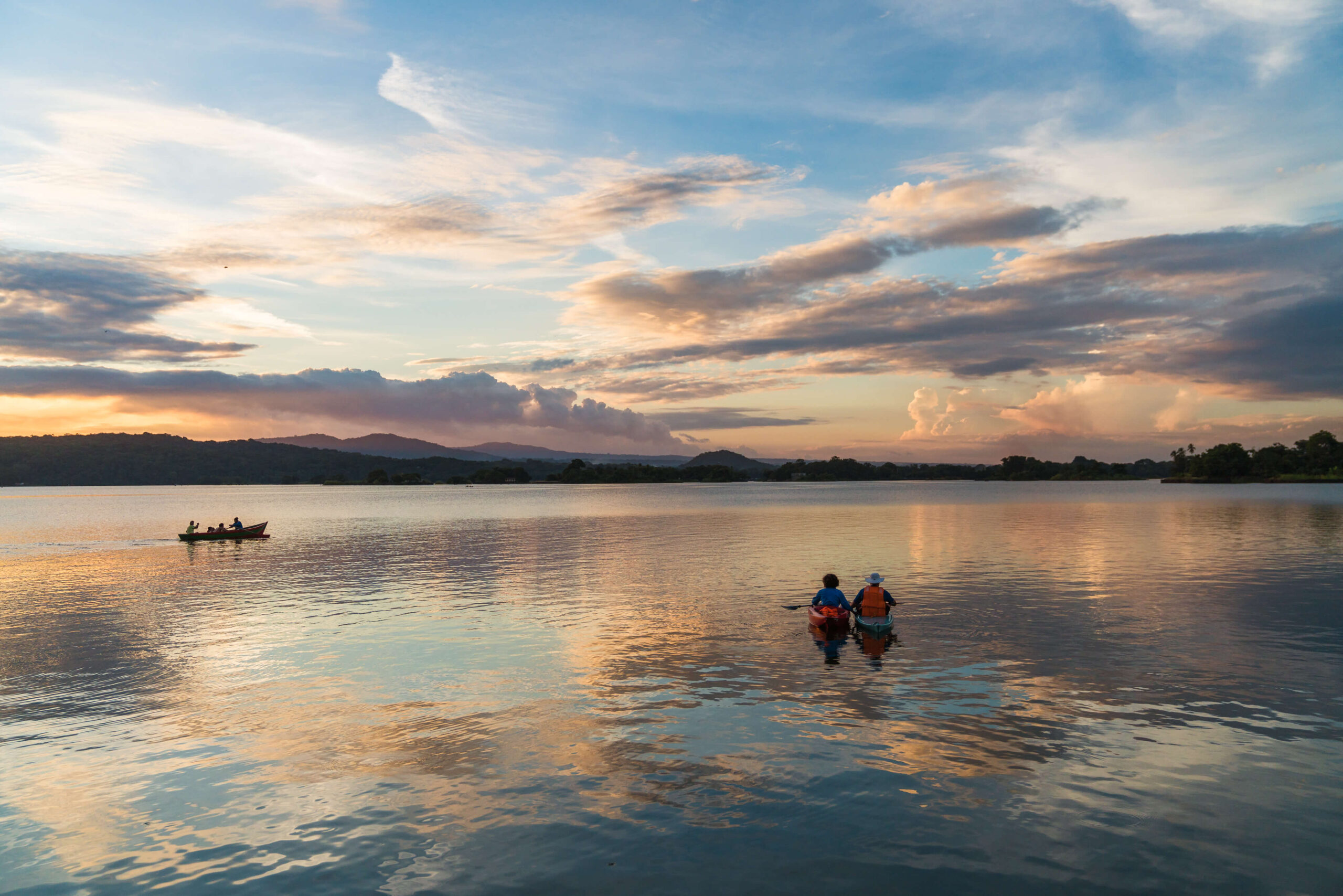 Kayaking on the lake beneath a colourful sunset sky, Jicaro Island Ecolodge, Lake Nicaragua, Granada, Nicaragua