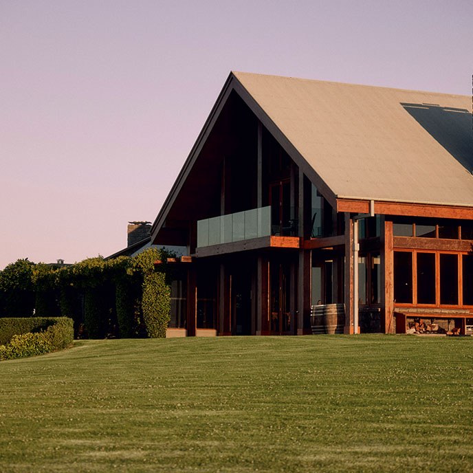 Cedar lodge facade in afternoon light at Spicers Peak Lodge