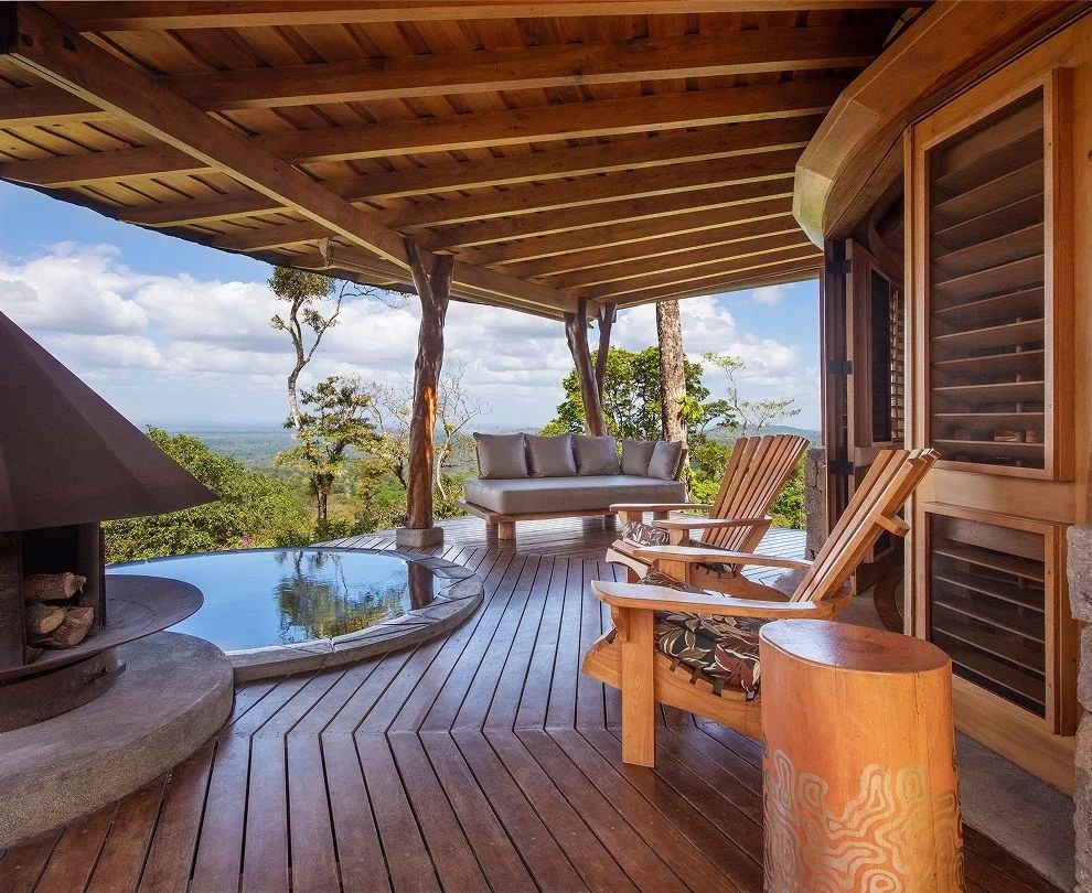 Private terrace hot tub beside a wood-burning heater, with valley views, Origins Luxury Lodge