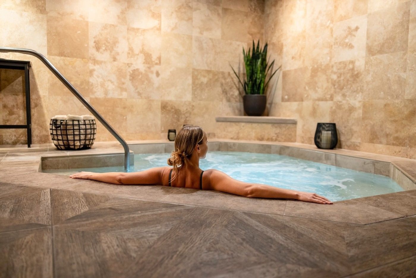 Indoor spa bathing pool with a guest at Stein Eriksen Lodge, Deer Valley, USA