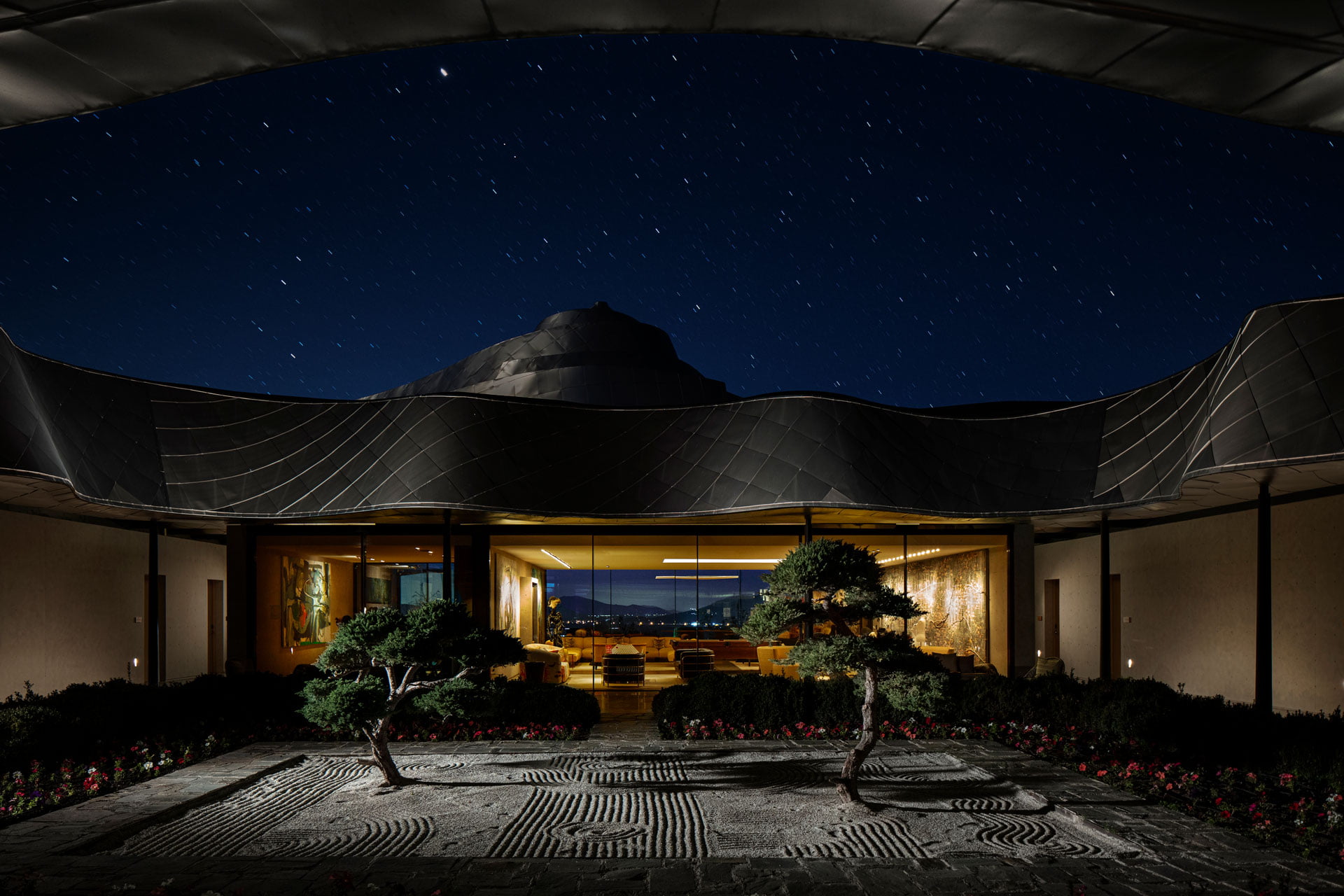 The Zen garden courtyard at night under a starry sky at VIK Chile, Millahue Valley, Chile