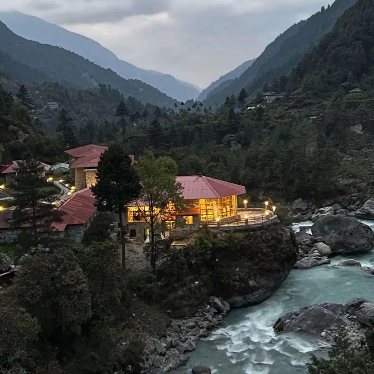 Lodge beside a river in a steep mountain valley at Yeti Mountain Home, Everest Region (Khumbu), Nepal