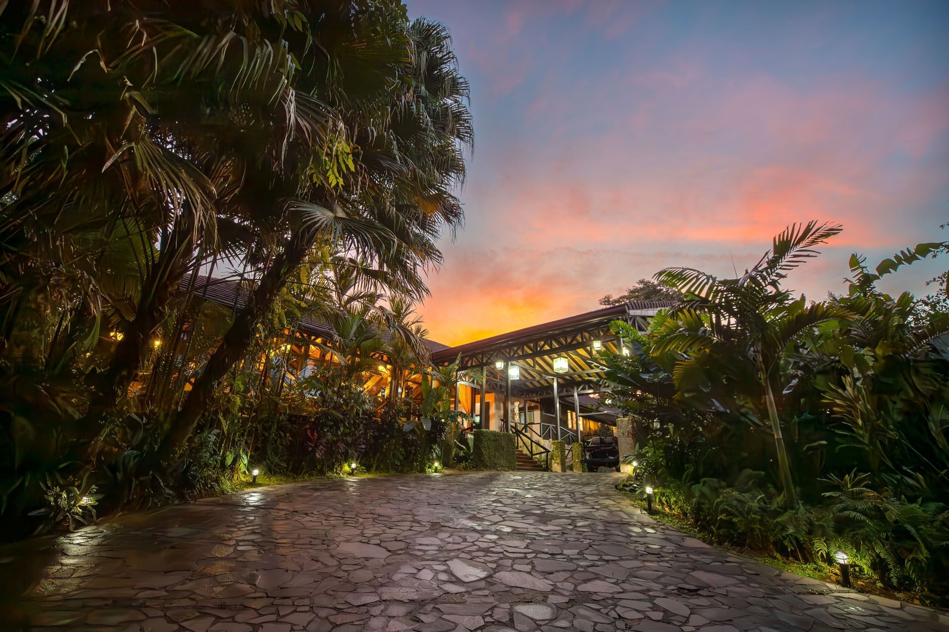 Tropical lodge exterior and garden pathway at sunset, Hideaway Rio Celeste, Tenorio, Costa Rica