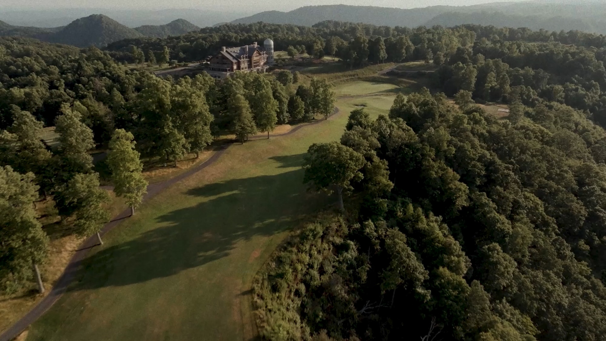 Aerial view of a Primland golf fairway bordered by woodland, Virginia, USA
