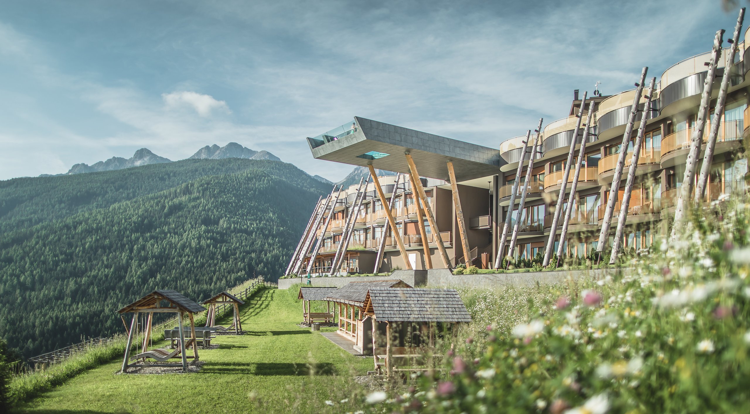 Alpin Panorama Hotel Hubertus exterior with mountain backdrop, Olang, Italy