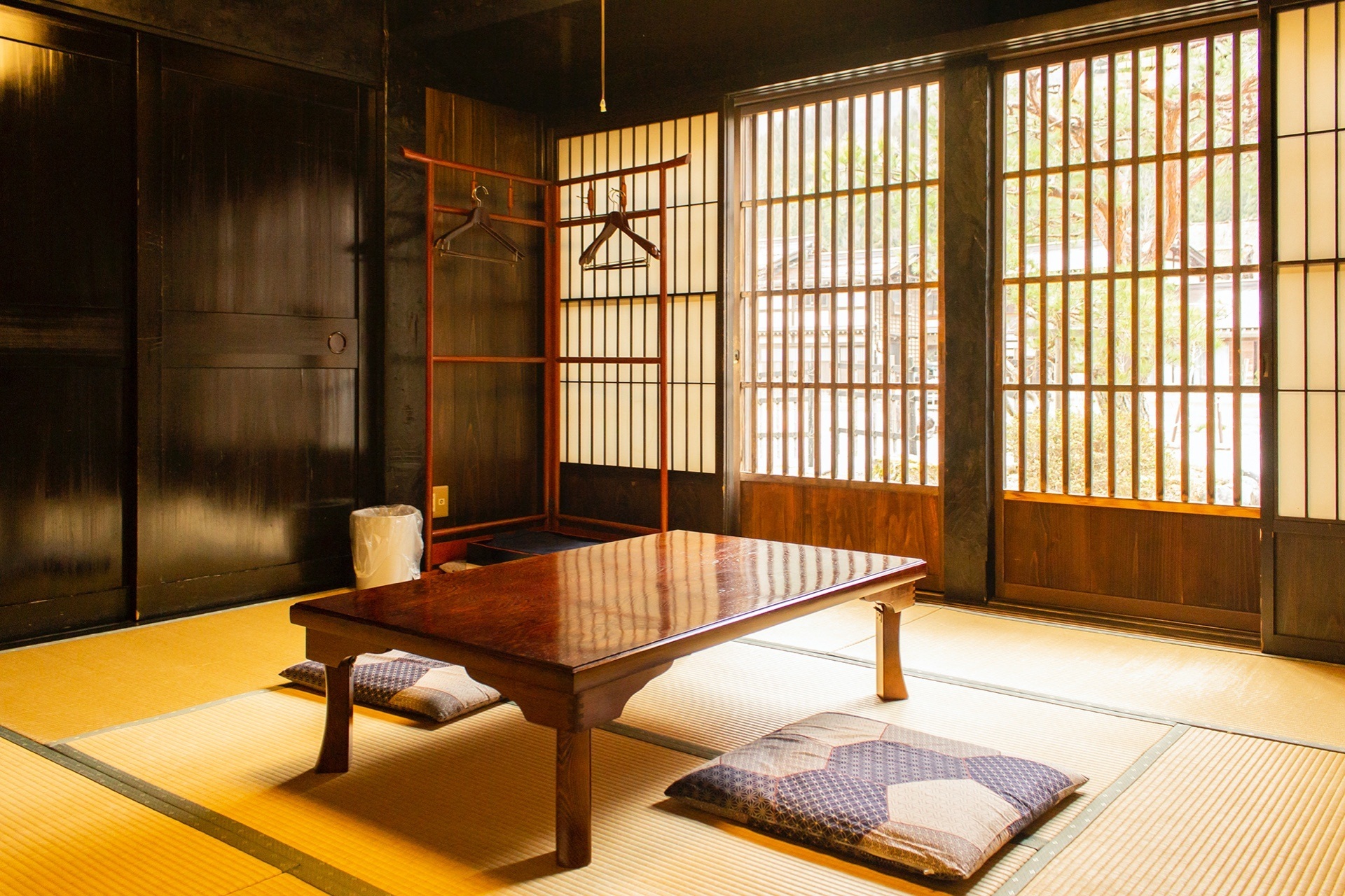 Tatami room with low table and floor cushions at Koemon, Shirakawa-go, Japan