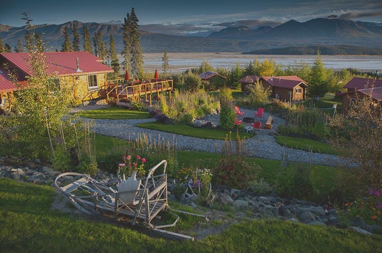Cabins overlooking the Chitina valley and distant mountains, Ultima Thule Lodge, Alaska, USA