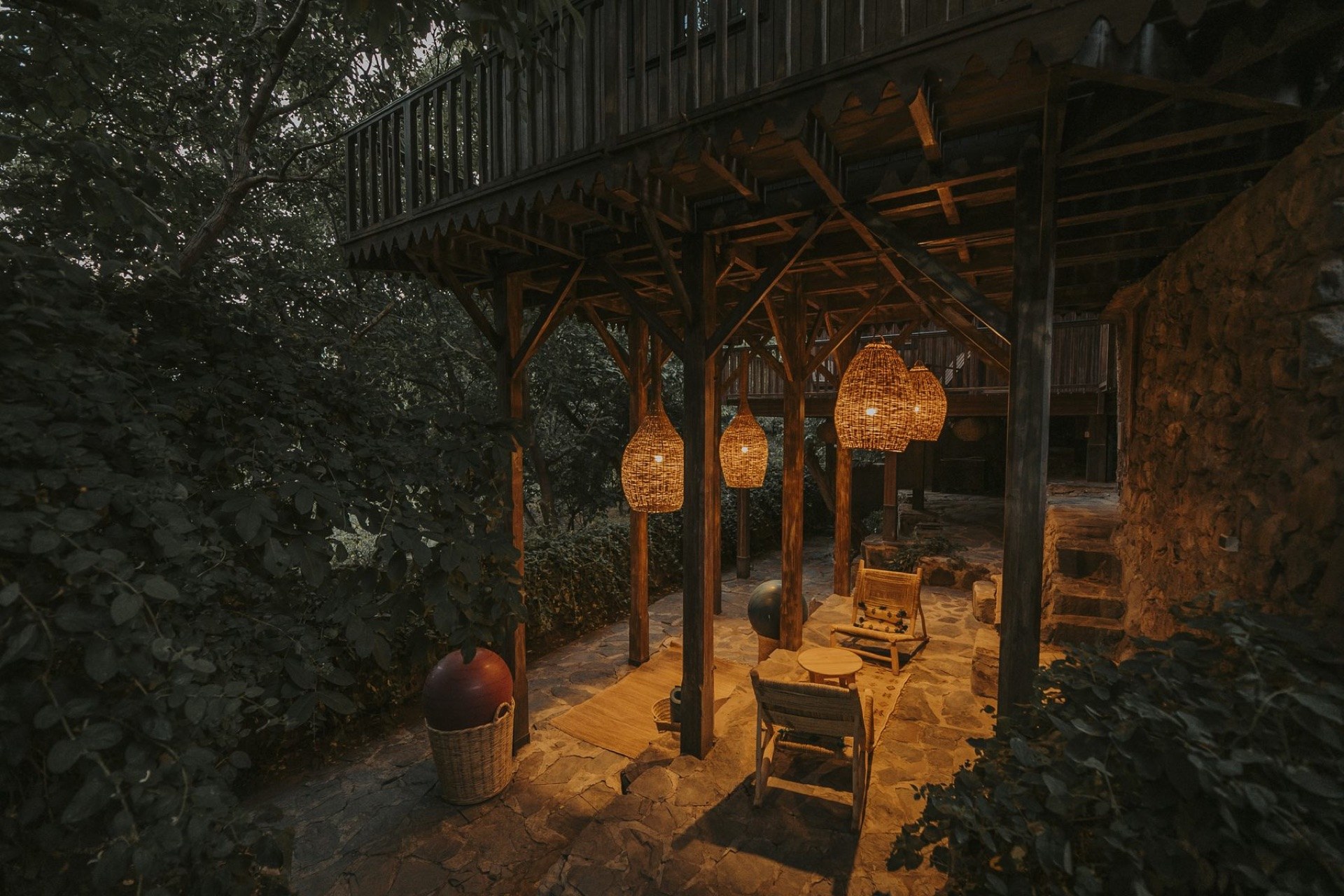 Lantern-lit covered terrace at Douar Samra at dusk