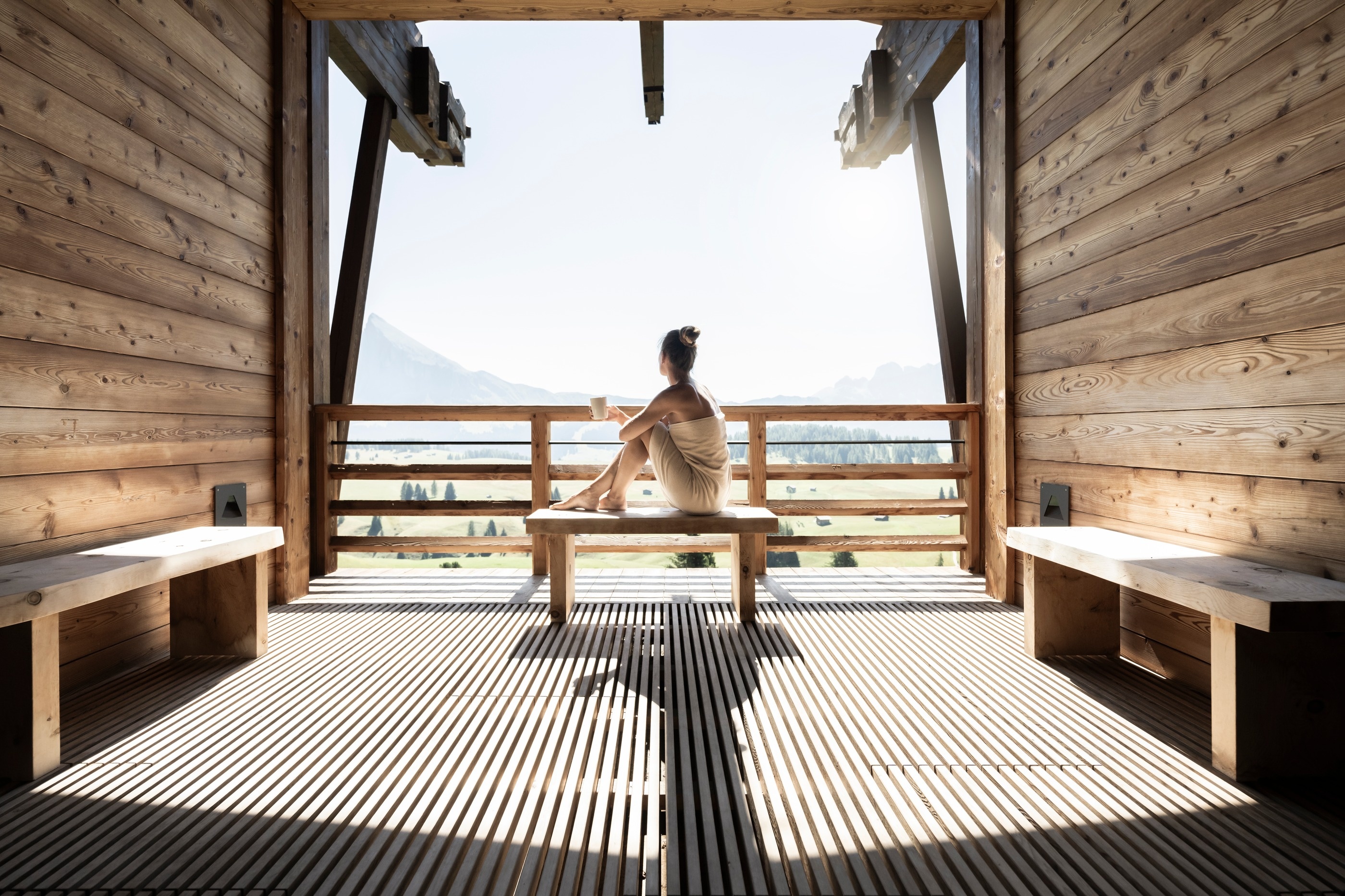 Wooden sauna with a panoramic mountain-facing window at Adler Mountain Lodge, Alpe di Siusi (Seiser Alm), Italy