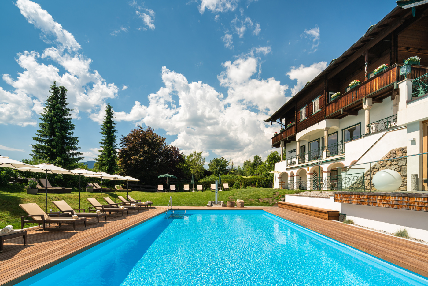 Outdoor pool beside the hotel, Tennerhof, Kitzbühel, Austria