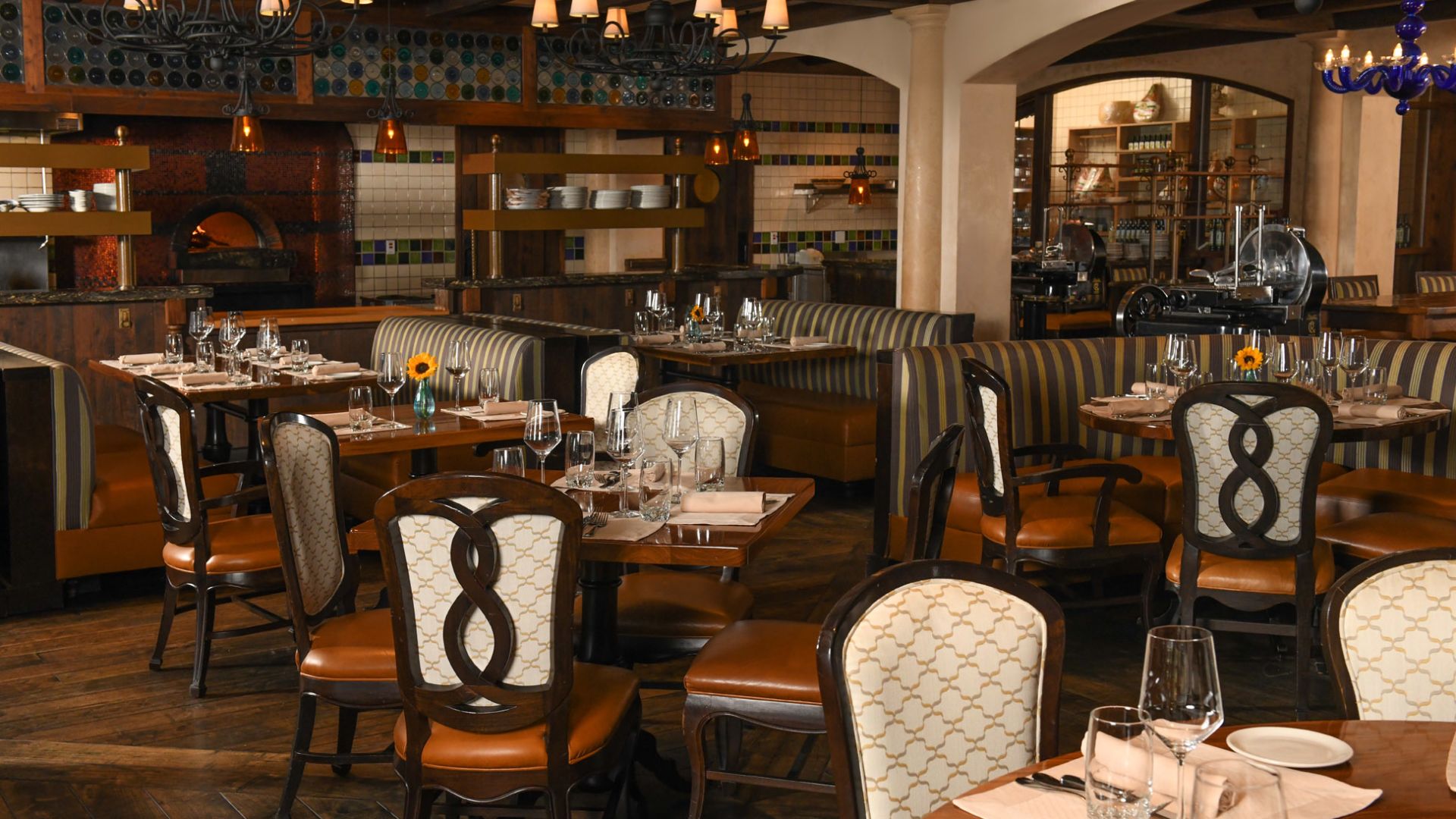 Ristorante Del Lago dining room with set tables and upholstered chairs at The Broadmoor, Colorado Springs, USA