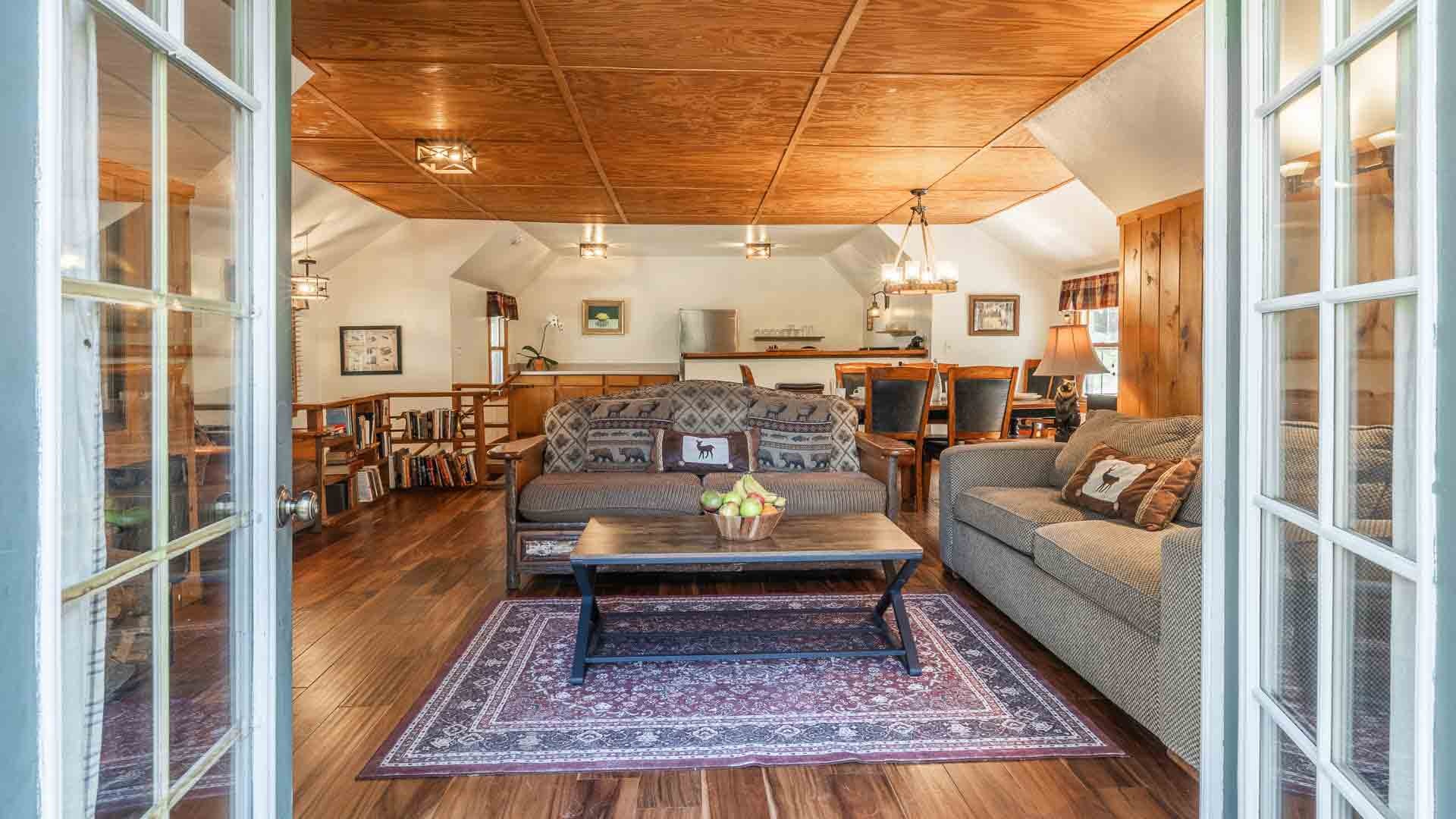 Living and dining area inside a deluxe cabin at Tamarack Lodge & Resort, Mammoth Lakes, USA