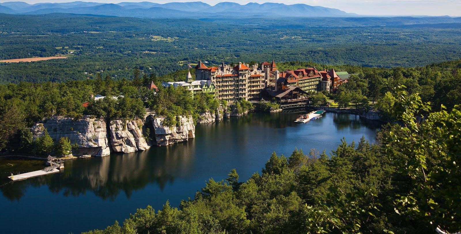 Aerial view of the Mountain House, lake and wooded hills at Mohonk Mountain House, New Paltz, USA