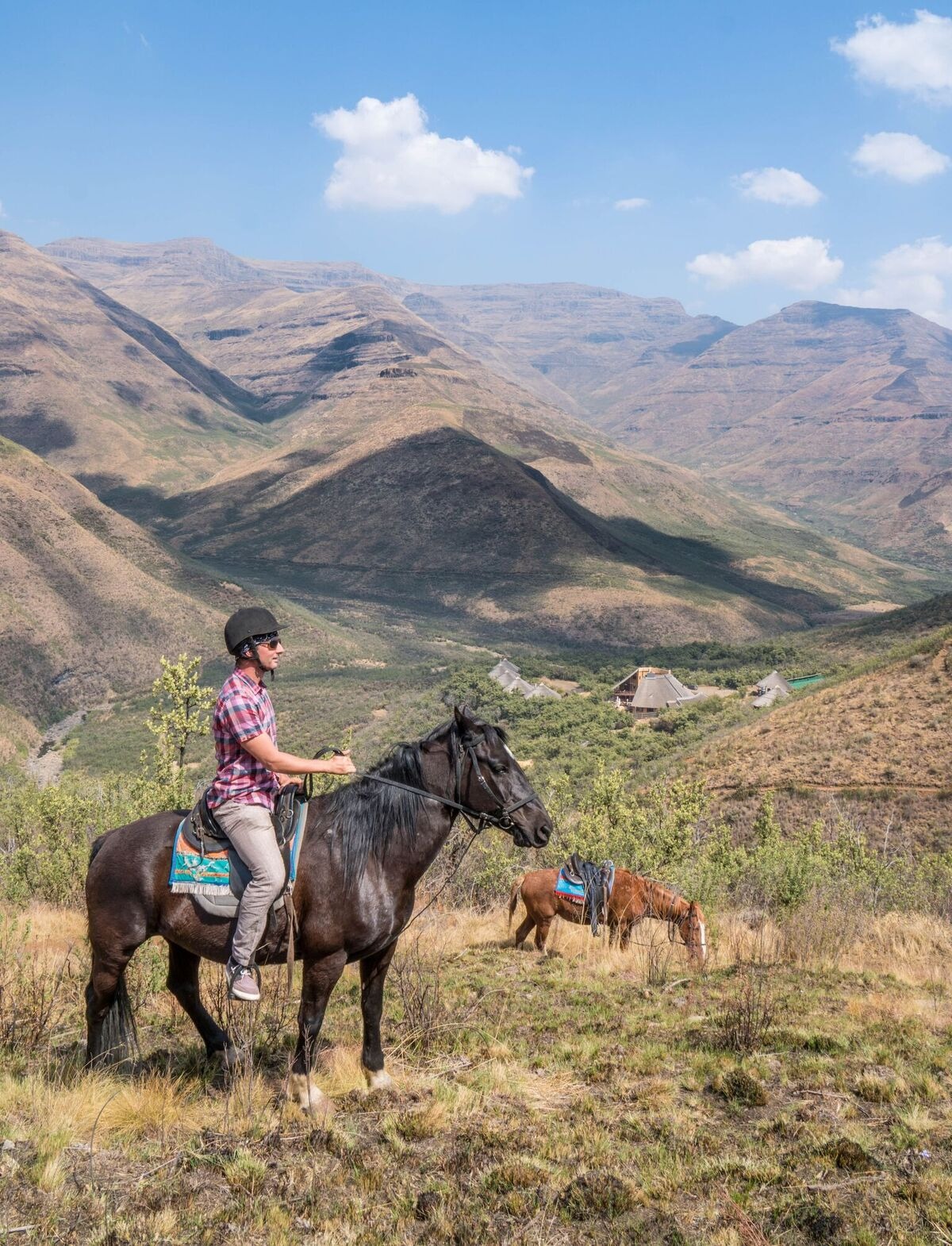 Horse riding through the mountain landscape, Maliba Mountain Lodge, Ts’ehlanyane National Park, Lesotho