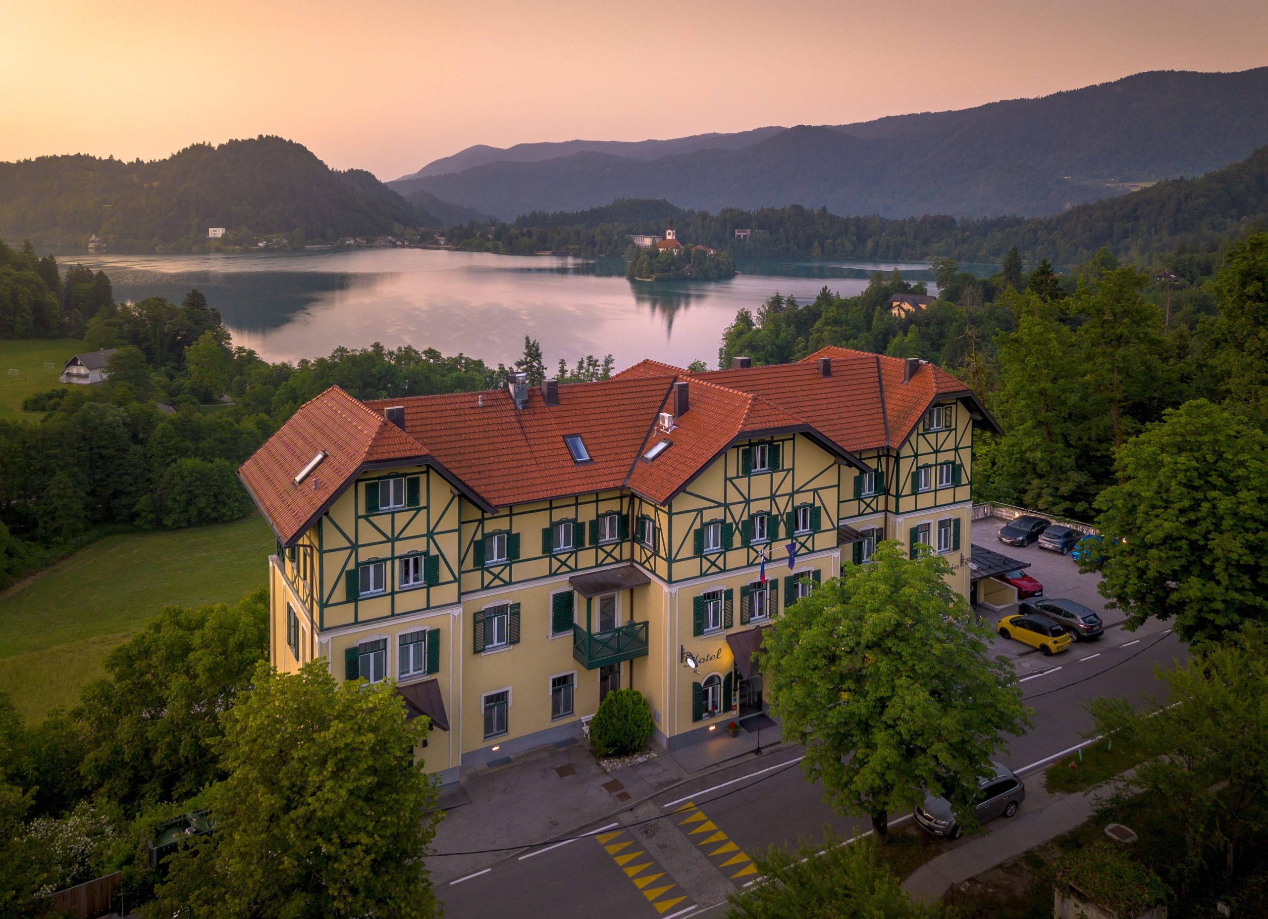 Hotel exterior overlooking Lake Bled and the surrounding hills