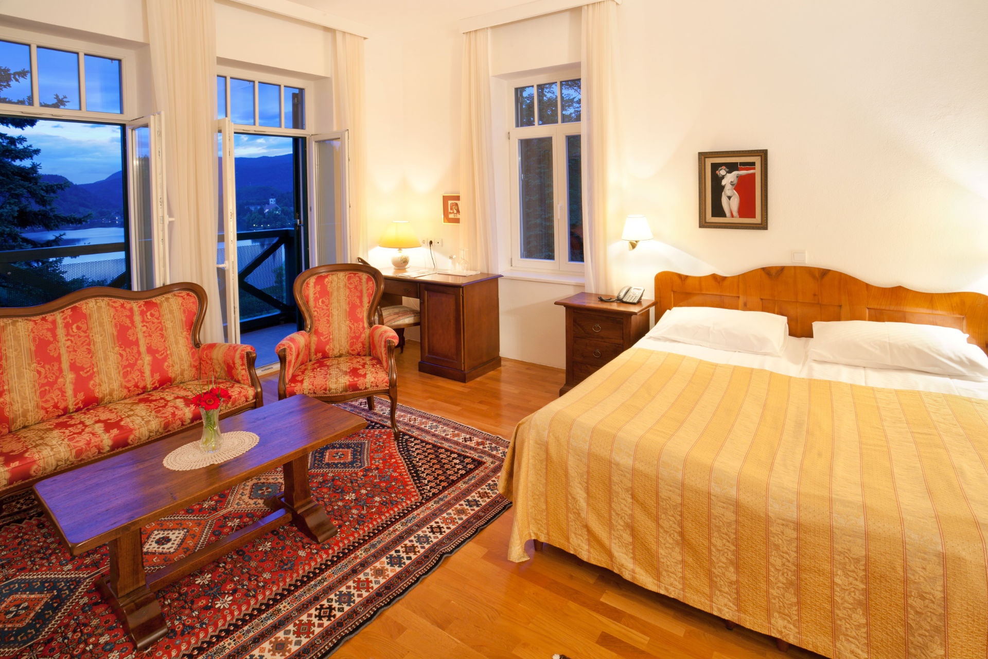 Guest room with a double bed and sitting area at Hotel Triglav Bled, Lake Bled, Slovenia