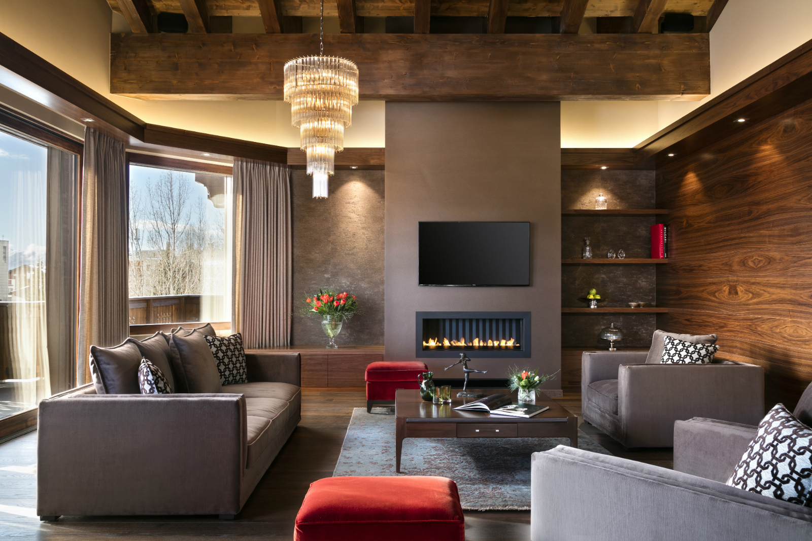 Suite apartment living room with fireplace and mountain-facing windows, Guarda Golf Hotel & Residences, Crans-Montana, Switzerland