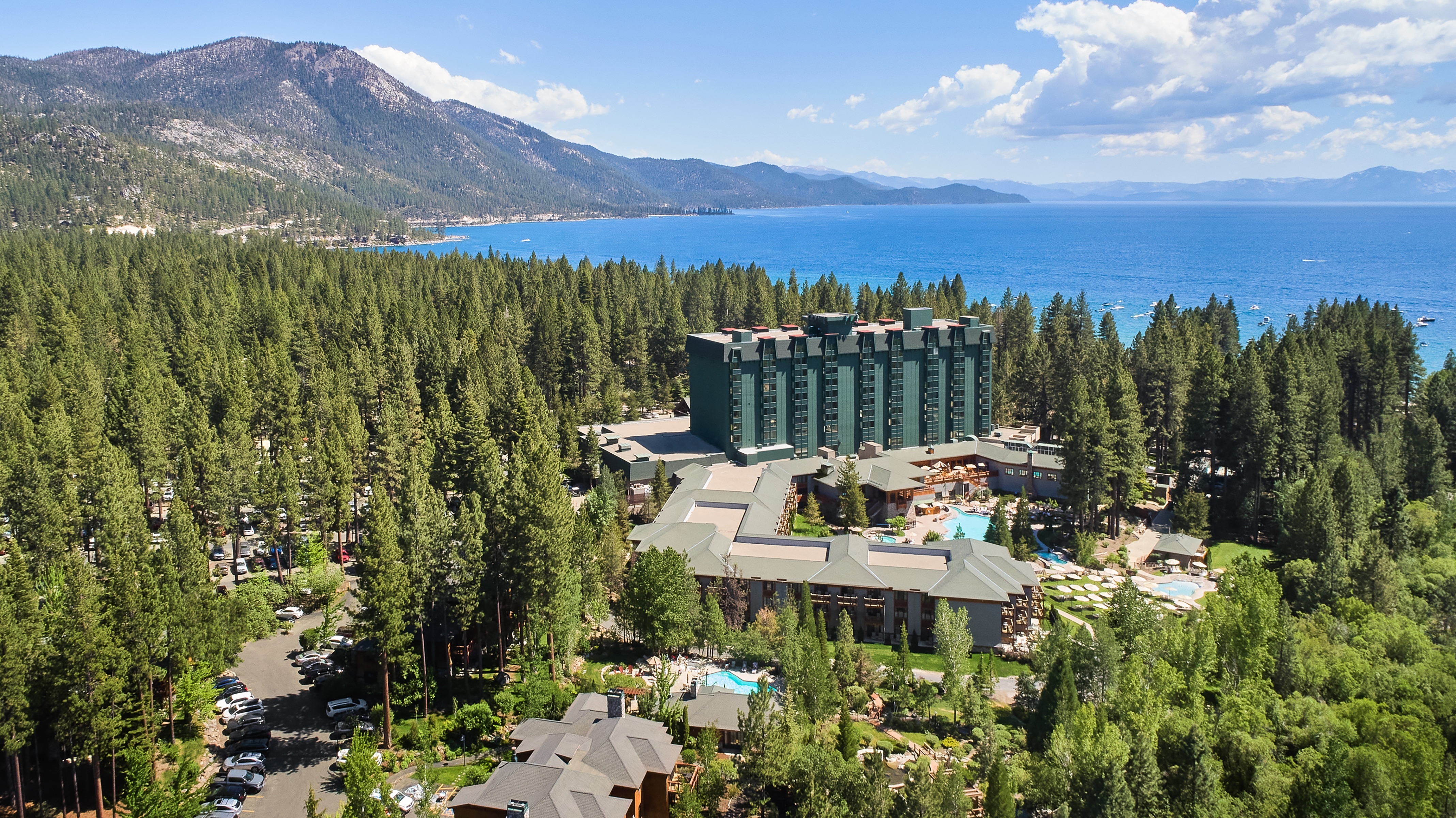 Aerial view of the resort, surrounding forest, Lake Tahoe, and mountains, Incline Village, USA