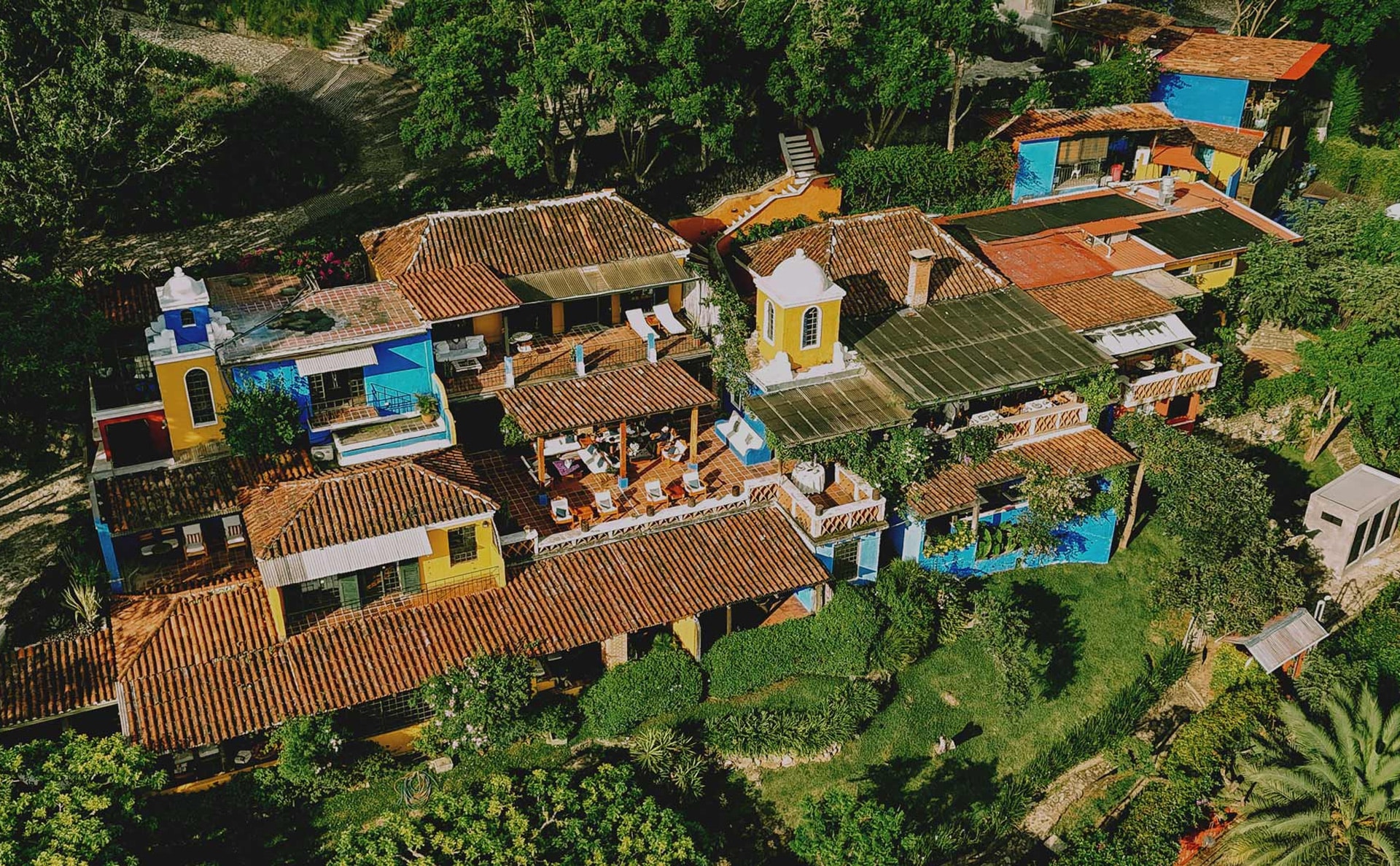 Aerial exterior of the colorful hillside hotel, Casa Palopó, Lake Atitlán, Guatemala