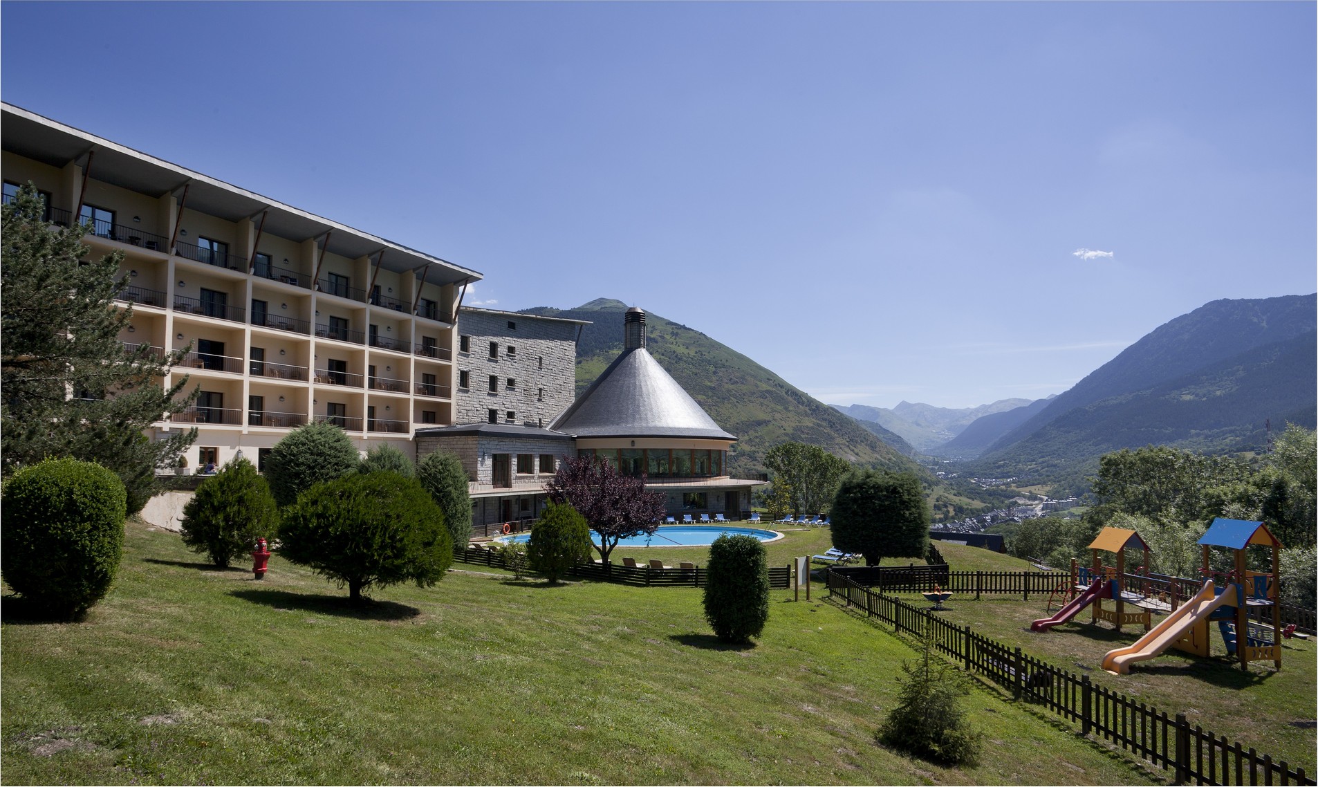 Parador exterior and gardens overlooking the mountain valley, Vielha, Spain