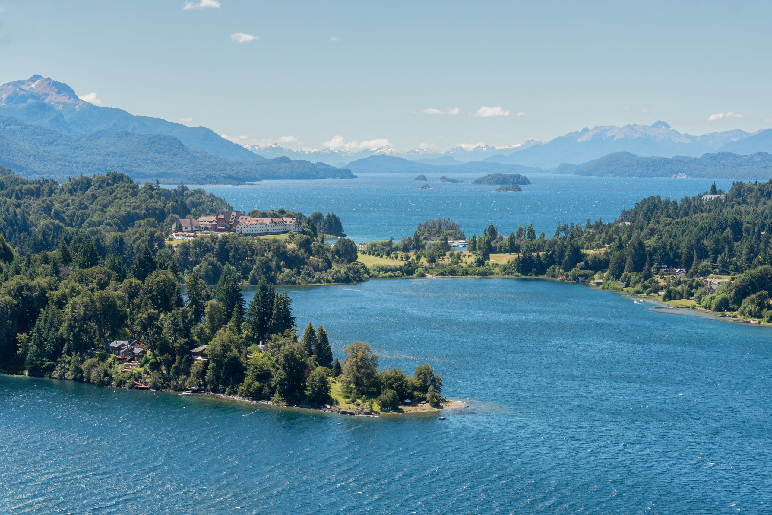 Llao Llao Hotel & Resort on its hilltop above Lake Nahuel Huapi with the Andes beyond, Bariloche, Argentina