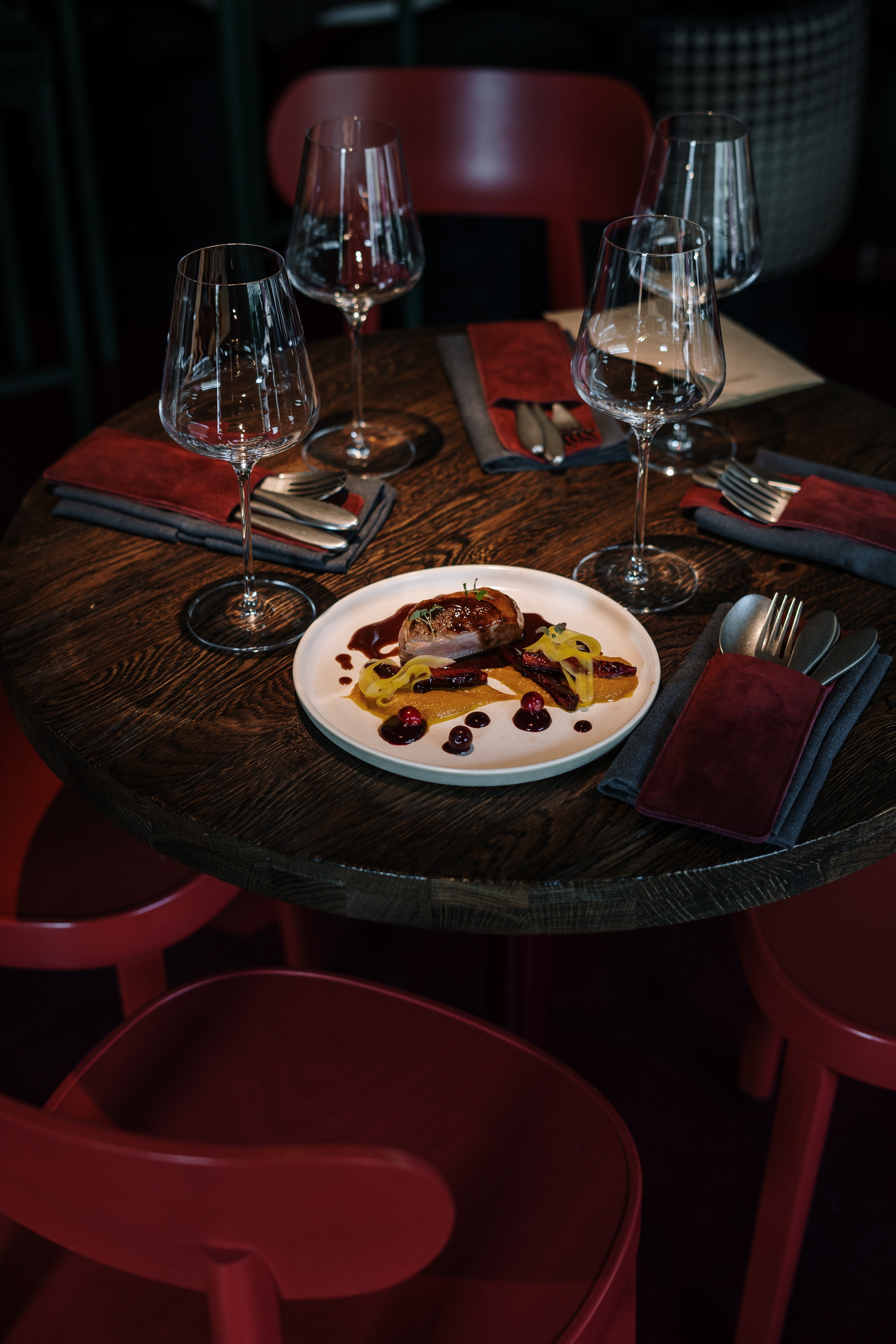 Restaurant table with a plated meal and glassware at Paliani Hotel, Mestia, Georgia