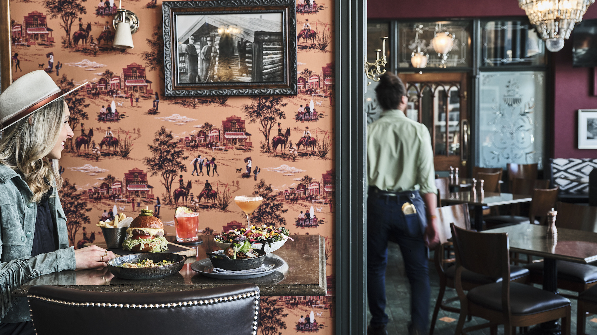 Seating and historic decor inside J-Bar at Hotel Jerome, Aspen, USA