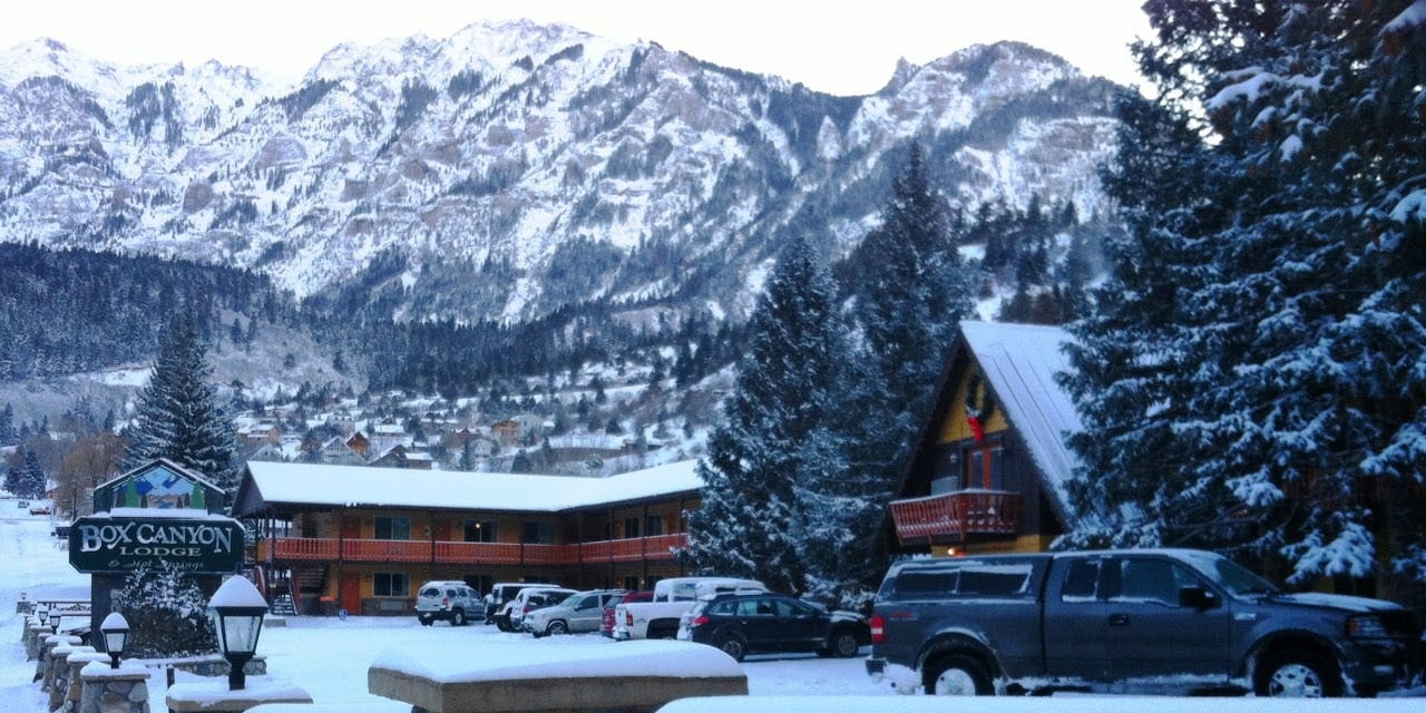 Snow-covered lodge and Ouray mountain backdrop at Box Canyon Lodge & Hot Springs, Ouray, USA