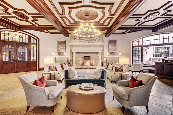 The Arrabelle lobby with fireplace and upholstered lounge seating