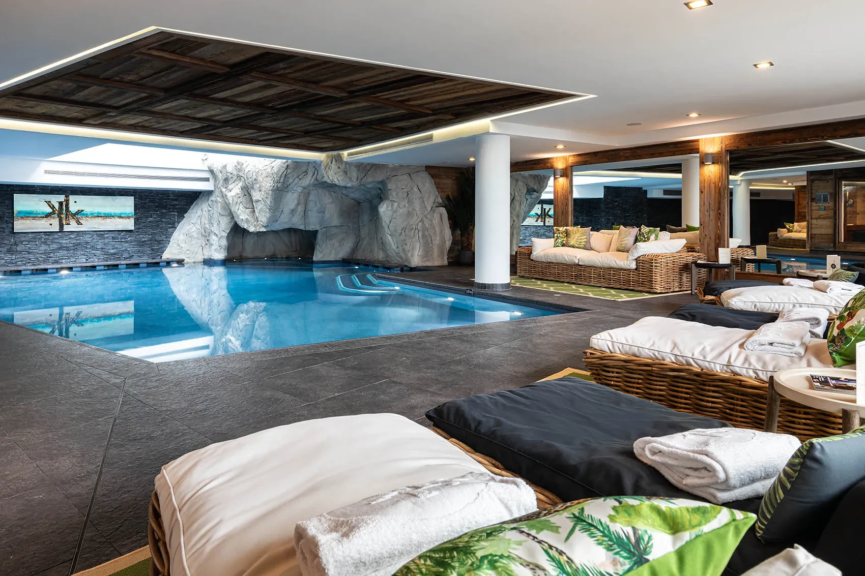Indoor swimming pool with poolside relaxation loungers, Le Kaïla, Méribel, France