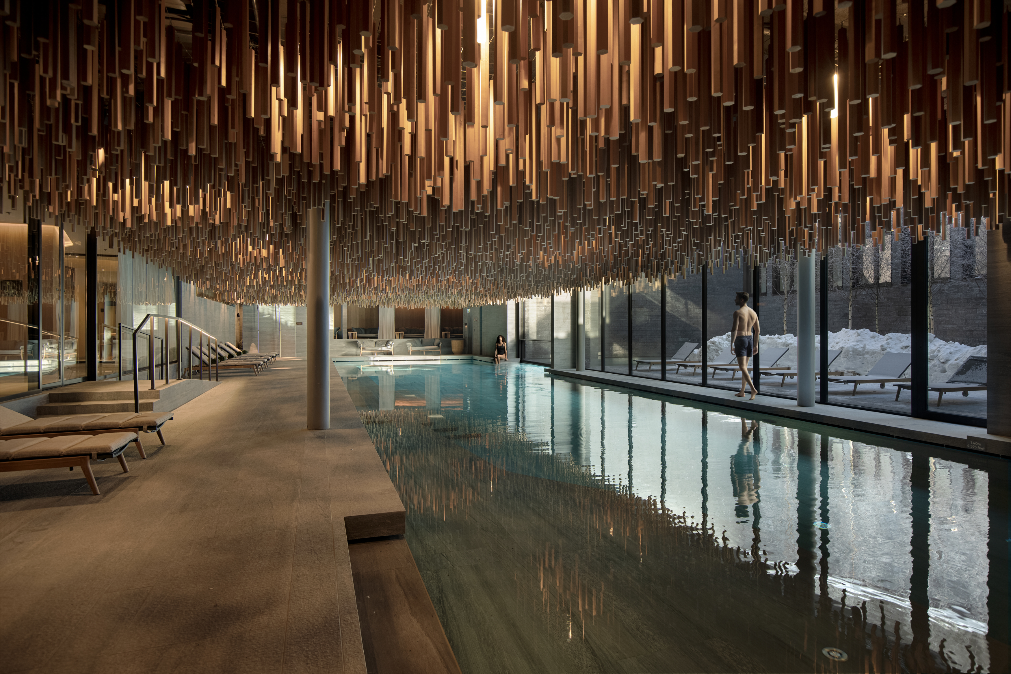 Indoor spa pool beneath suspended timber ceiling, Six Senses Crans-Montana, Crans-Montana, Switzerland