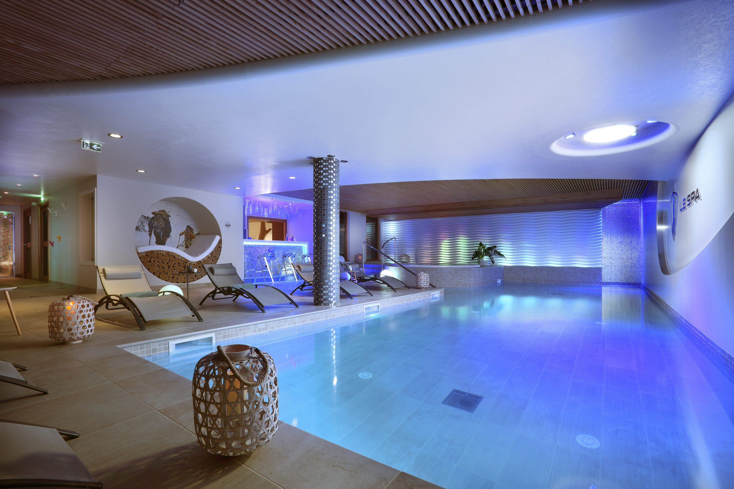 Indoor spa pool illuminated in blue, Hotel Pashmina Le Refuge, Val Thorens, France