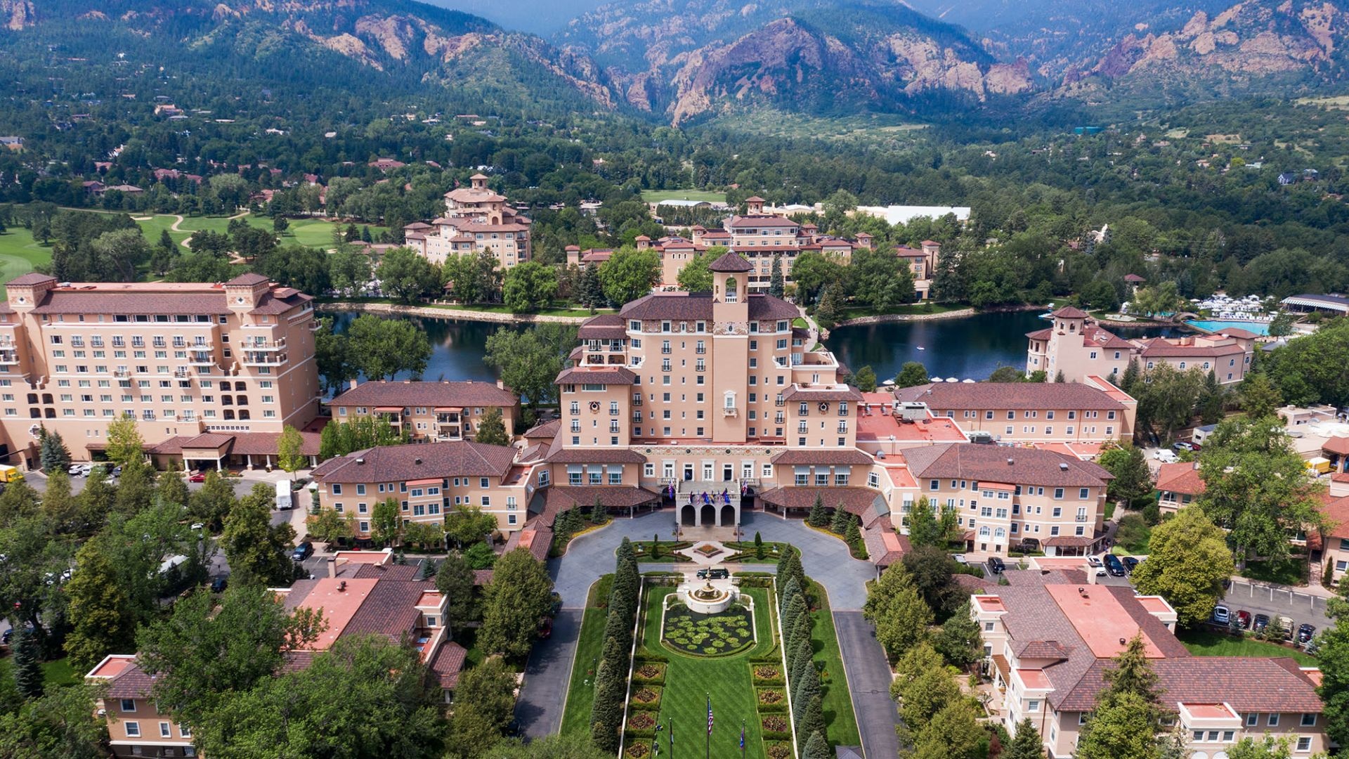 Aerial view of The Broadmoor with mountains behind the resort, Colorado Springs, USA