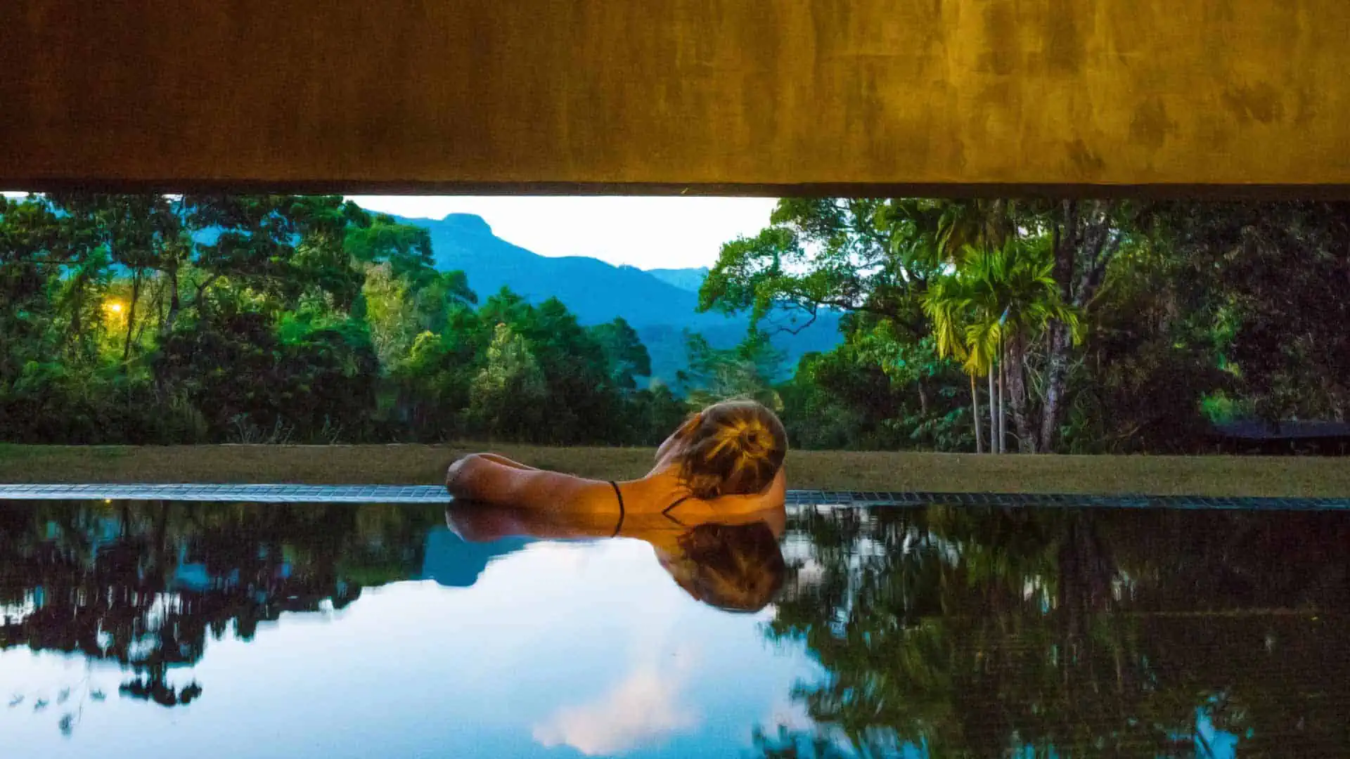 Thermal spa pool framing the green mountain valley at Santani Wellness Resort & Spa, Sri Lanka