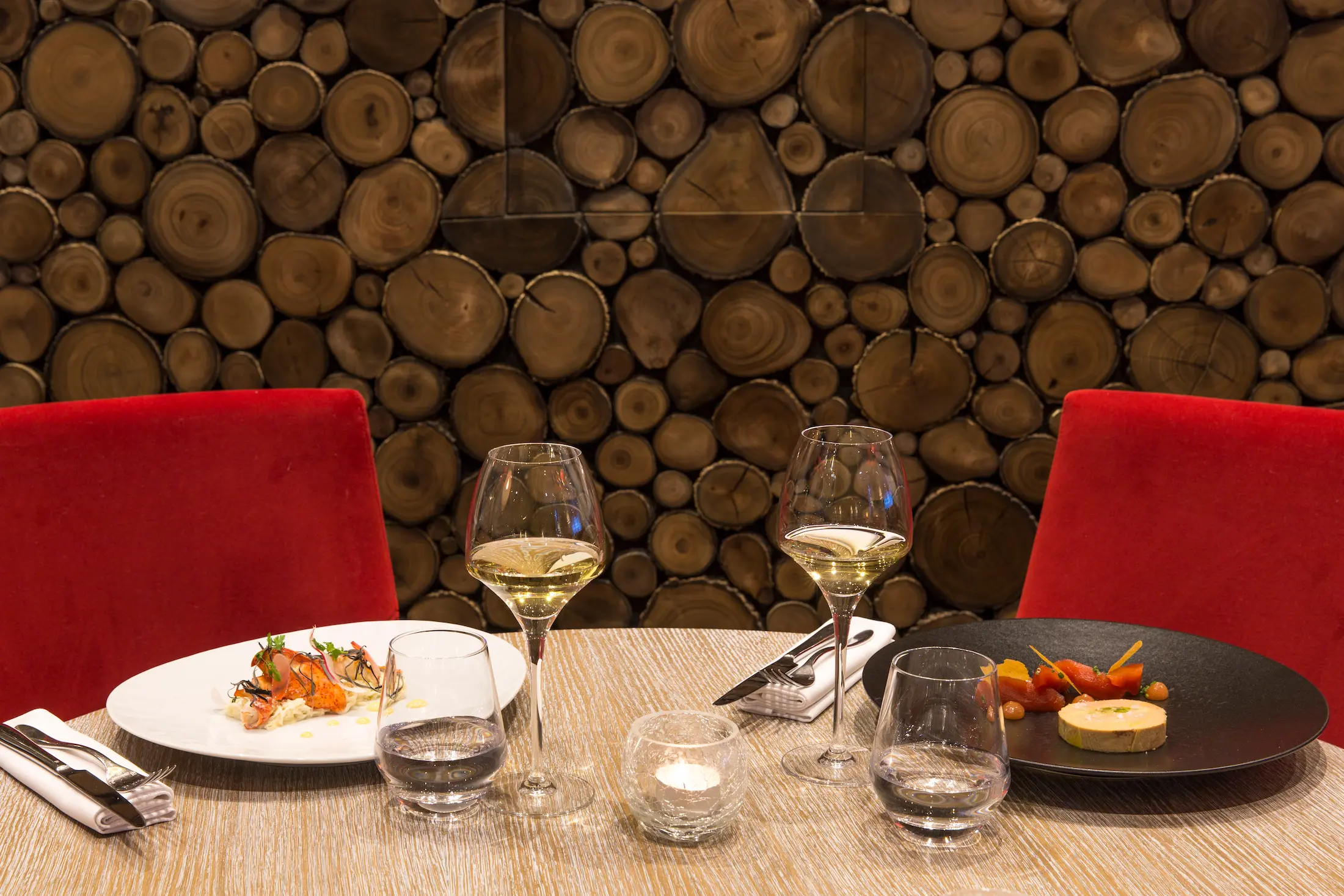 Plated dishes and wine glasses at Le Matafan restaurant, Hôtel Mont-Blanc, Chamonix, France