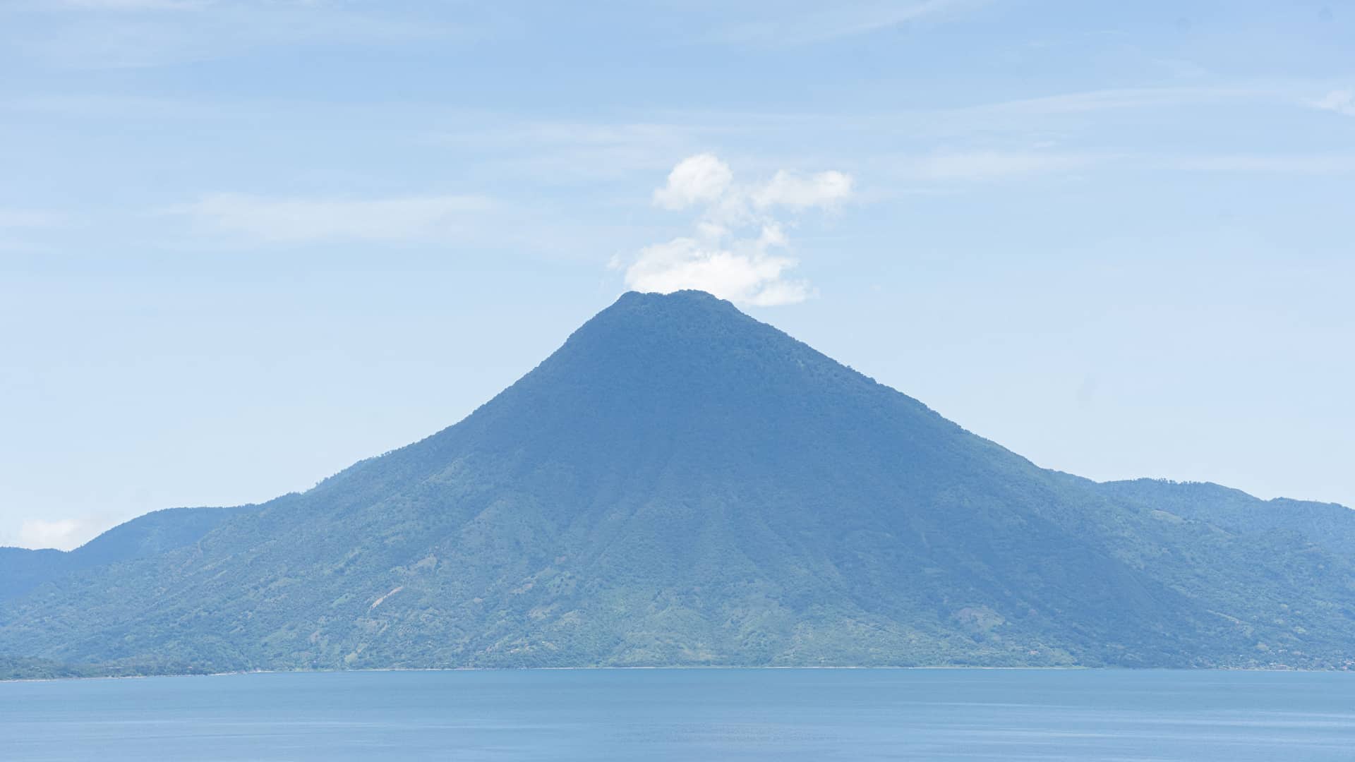 Volcano view across the blue lake, Casa Palopó, Lake Atitlán, Guatemala
