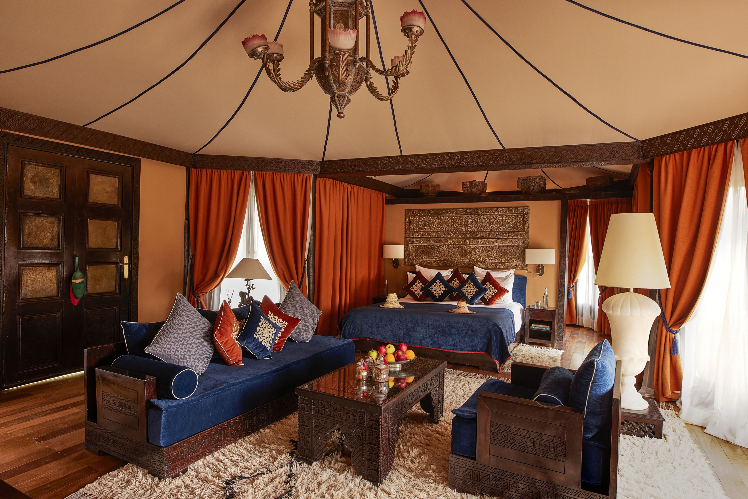Luxury Berber Tent with Moroccan textiles and sitting area at Kasbah Tamadot, Atlas Mountains, Morocco