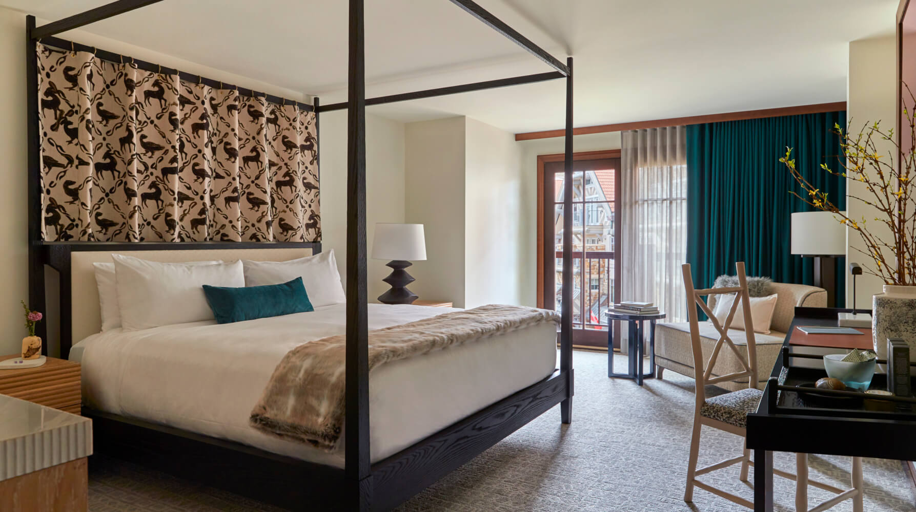 Guest room at Madeline Hotel & Residences with a four-poster bed and seating area, Telluride, USA