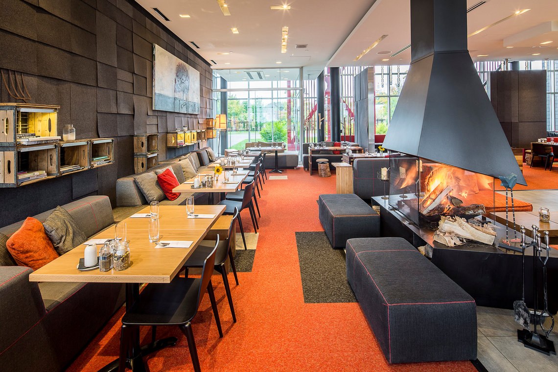 Contemporary restaurant and fireplace at Le Germain Charlevoix