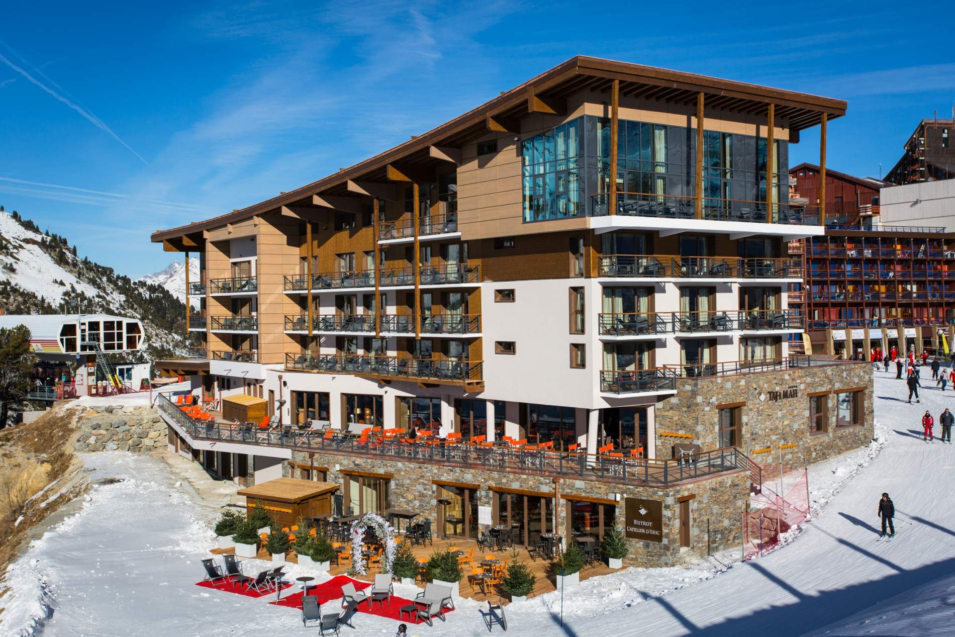 Hotel exterior and sunny ski terrace, Hotel Taj-I Mah, Les Arcs, France