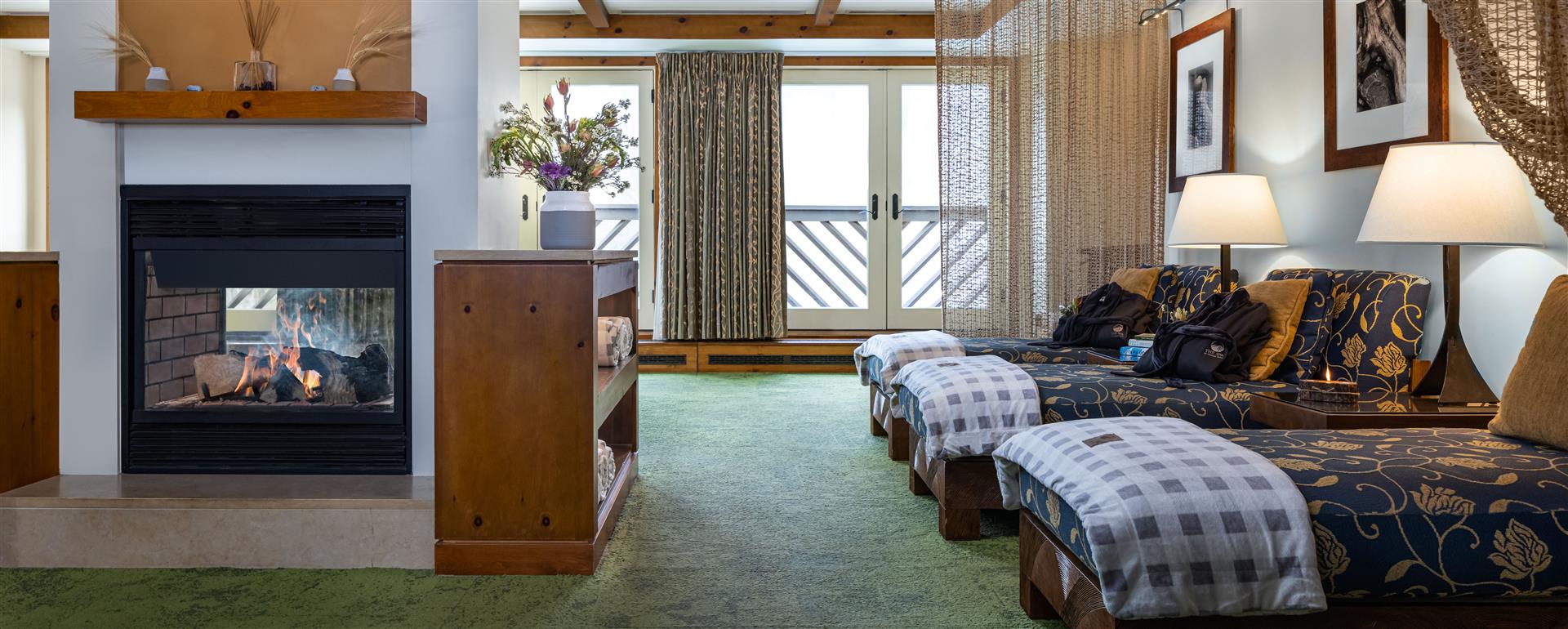 Spa relaxation lounge with fireplace, The Lodge at Spruce Peak, Stowe, USA