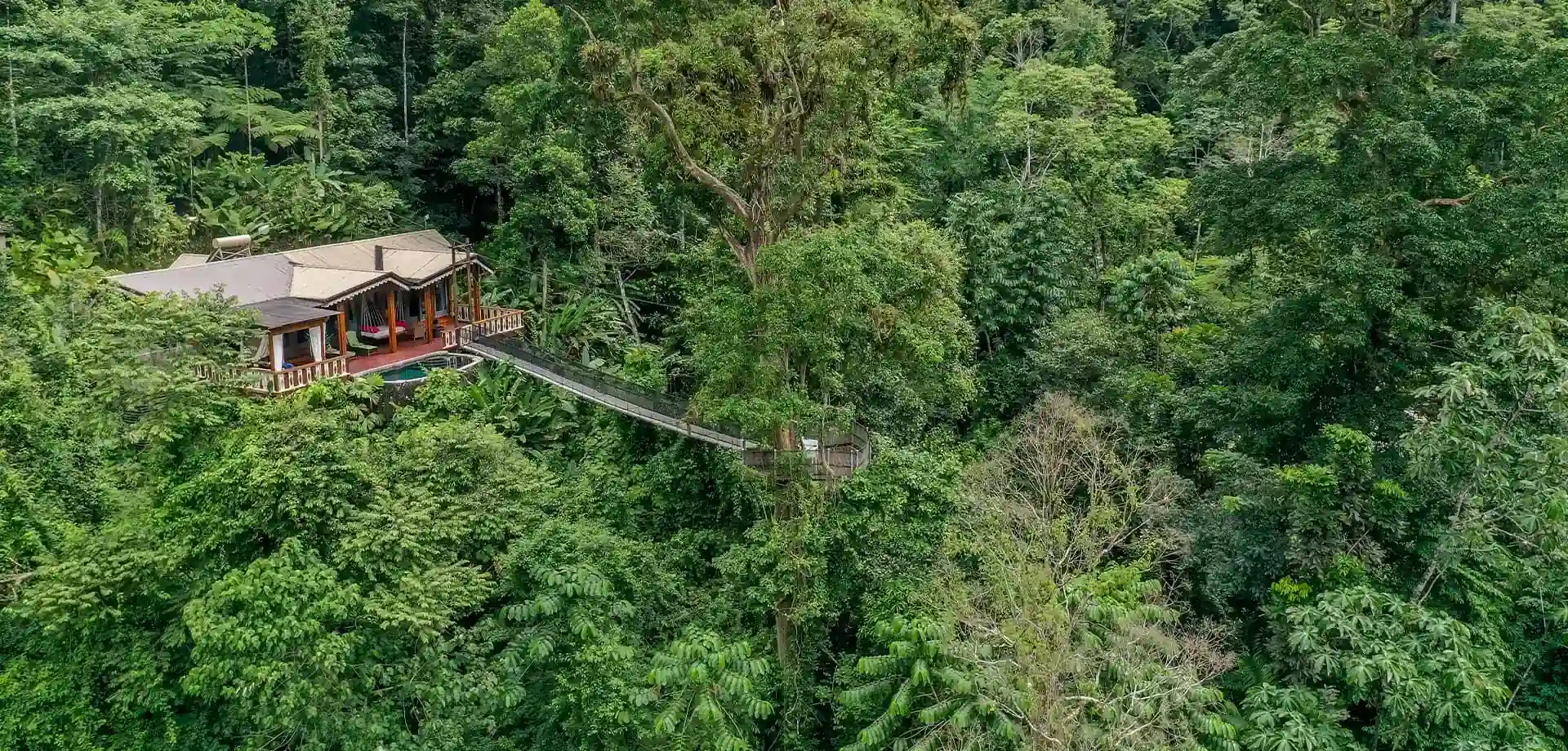 Forest lodge exterior connected by a suspension bridge, Pacuare Lodge, Pacuare River, Costa Rica