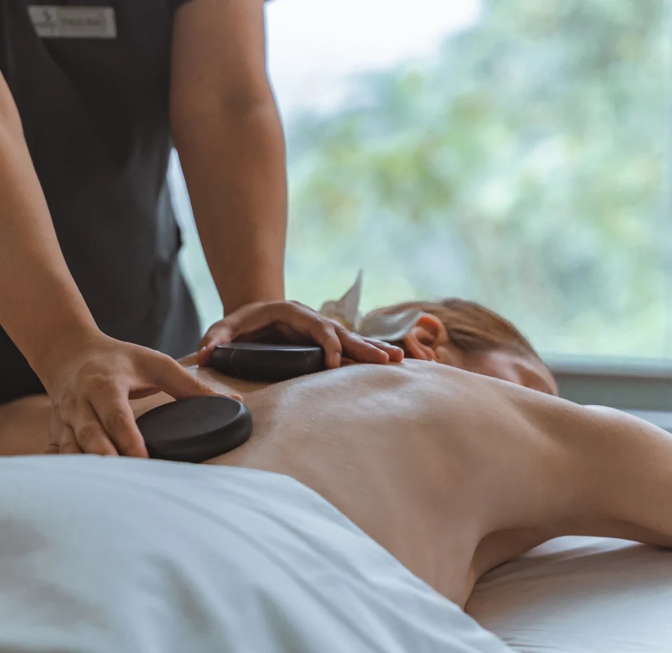 Stone massage beside a window at the Samay Wellness Center at Mashpi Lodge, Ecuador