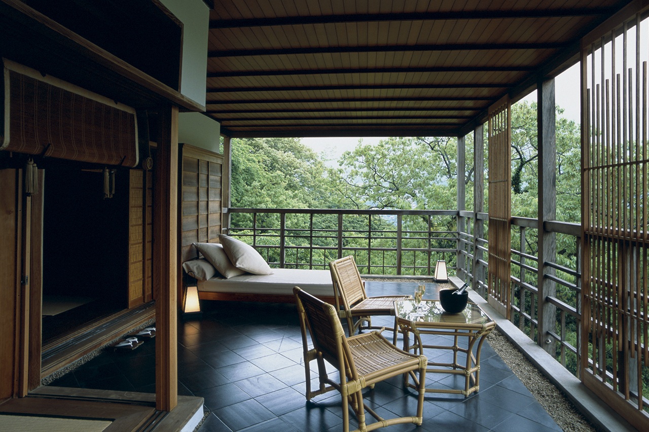 Covered balcony overlooking wooded hills at Gora Kadan, Hakone, Japan