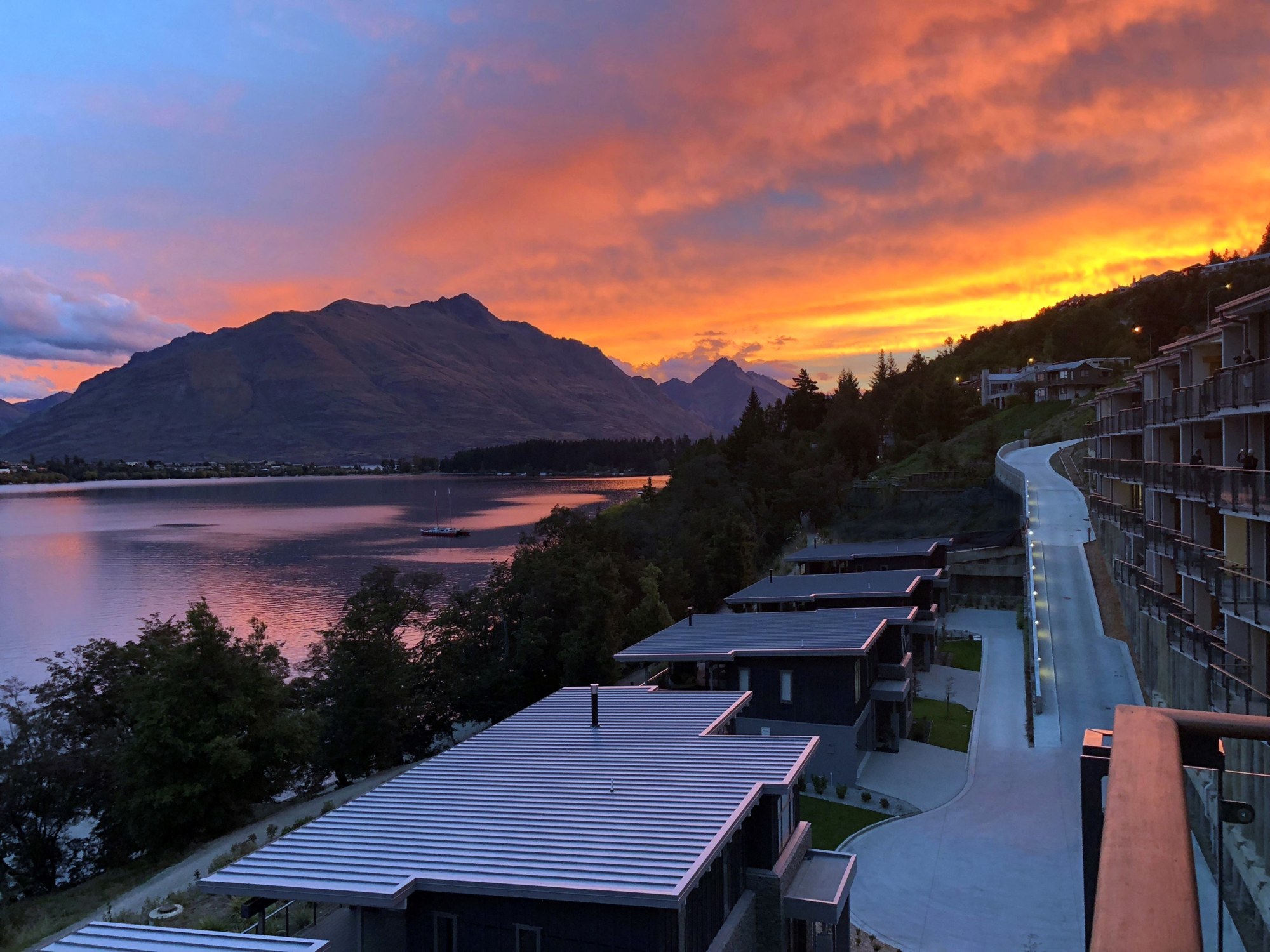 The Rees Hotel on Lake Wakatipu at sunset beneath the Remarkables