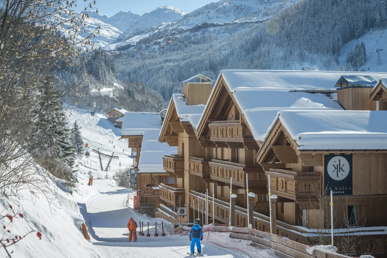 Hotel beside the snowy ski slopes and mountain valley, Le Kaïla, Méribel, France