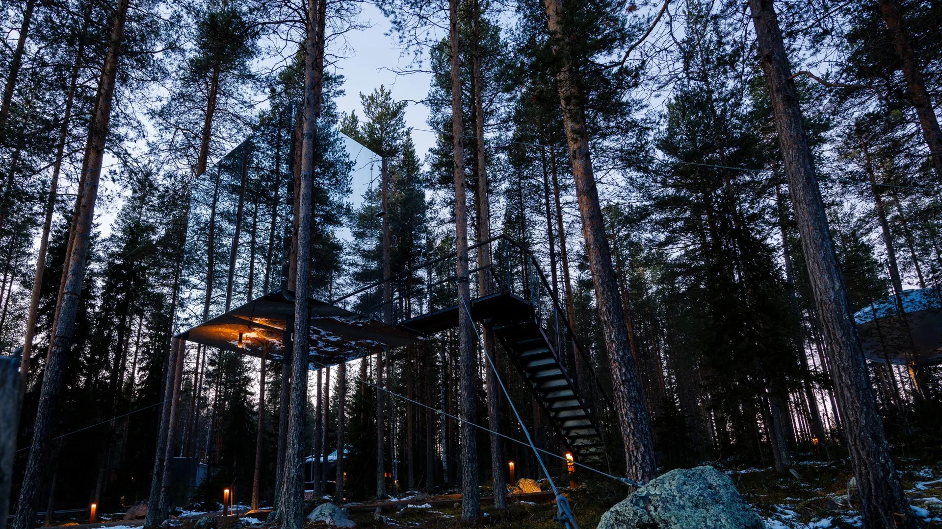 Mirrorcube treehouse reflecting the surrounding forest at Treehotel, Harads, Swedish Lapland