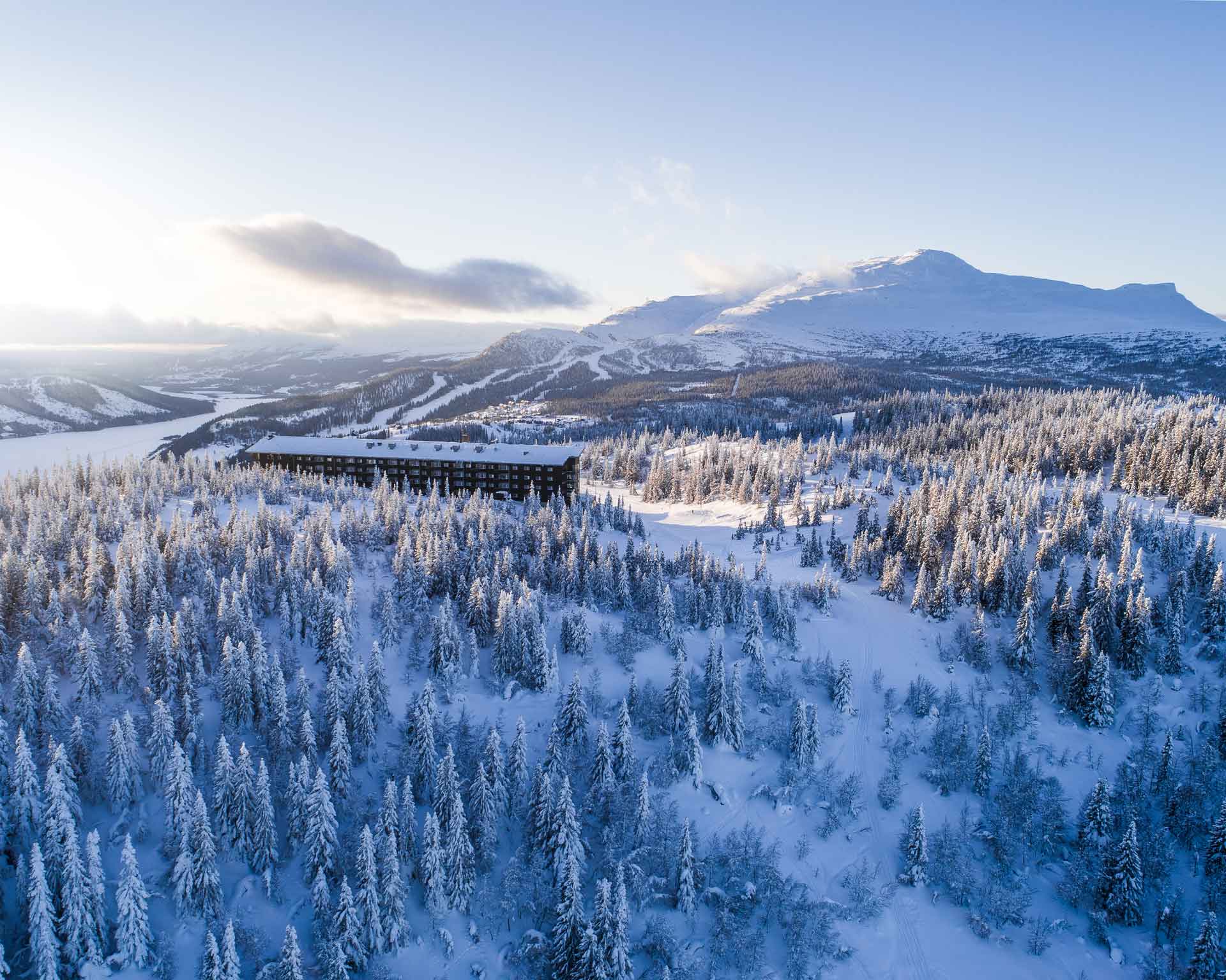 Snow-covered forest and mountain landscape at Copperhill Mountain Lodge, Åre, Sweden